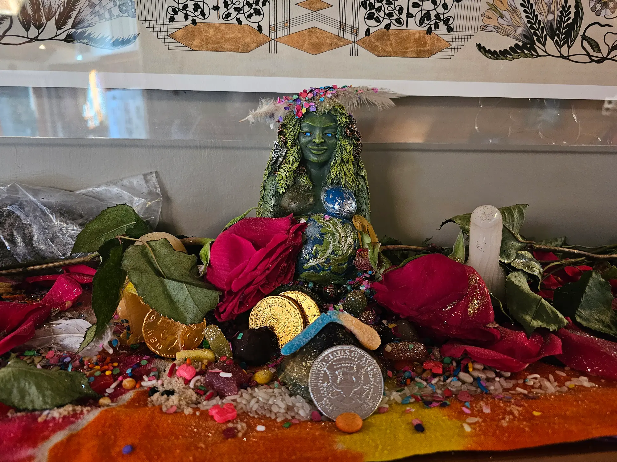 Colorful sacred altar with Ganesha statue, flowers, and ceremonial offerings for small group ceremony