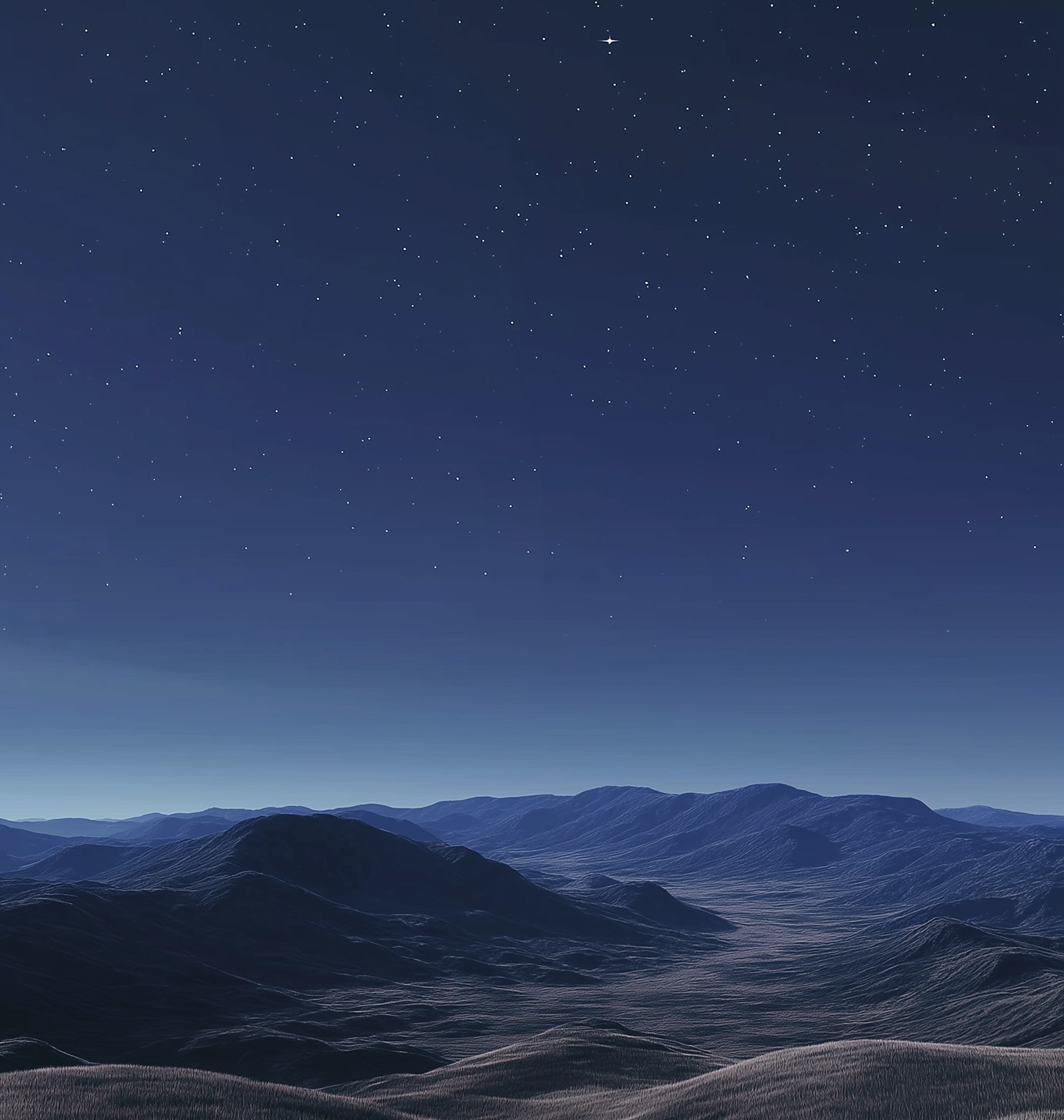 blue night sky over distant mountains