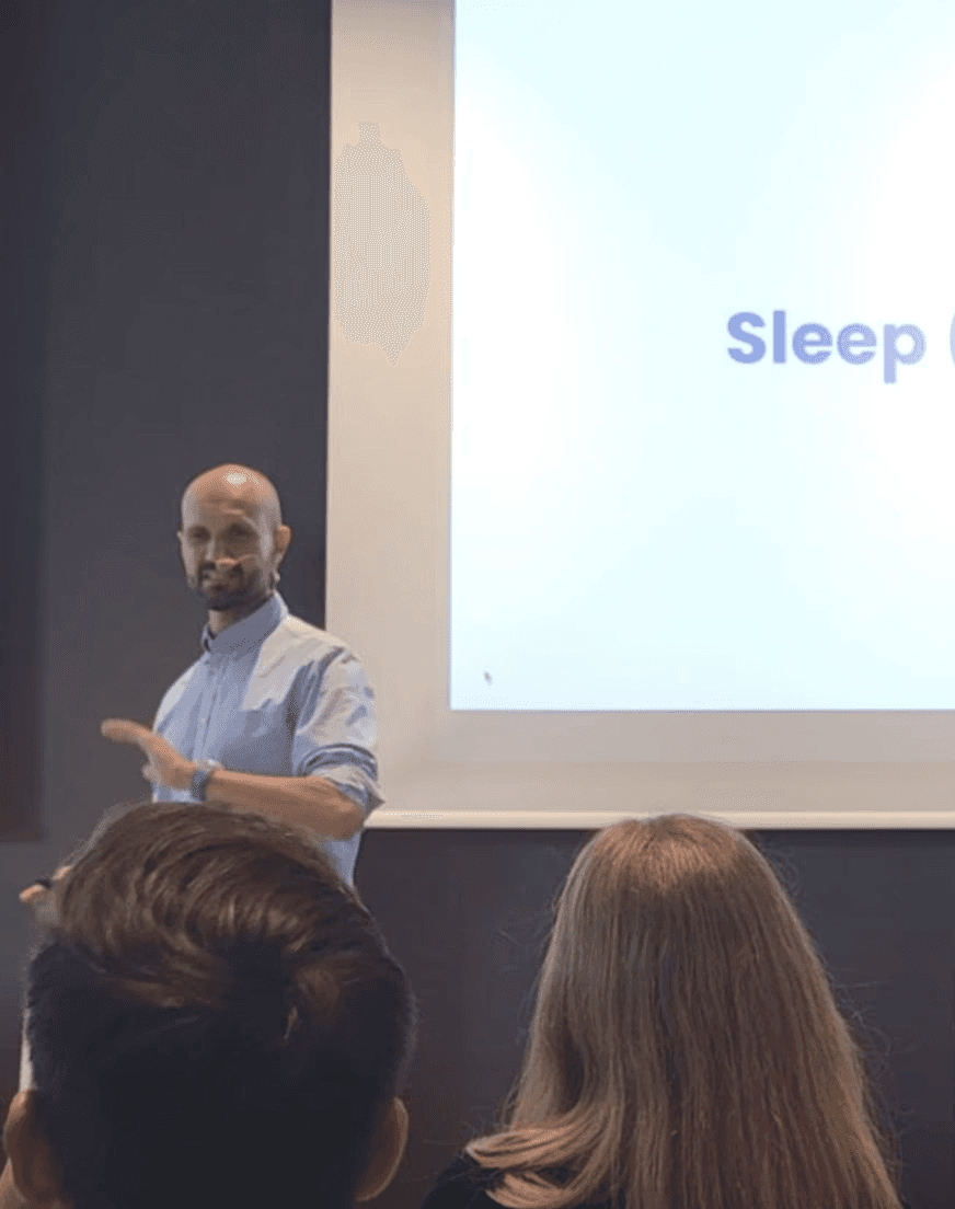 person sitting in a chair in front of a man