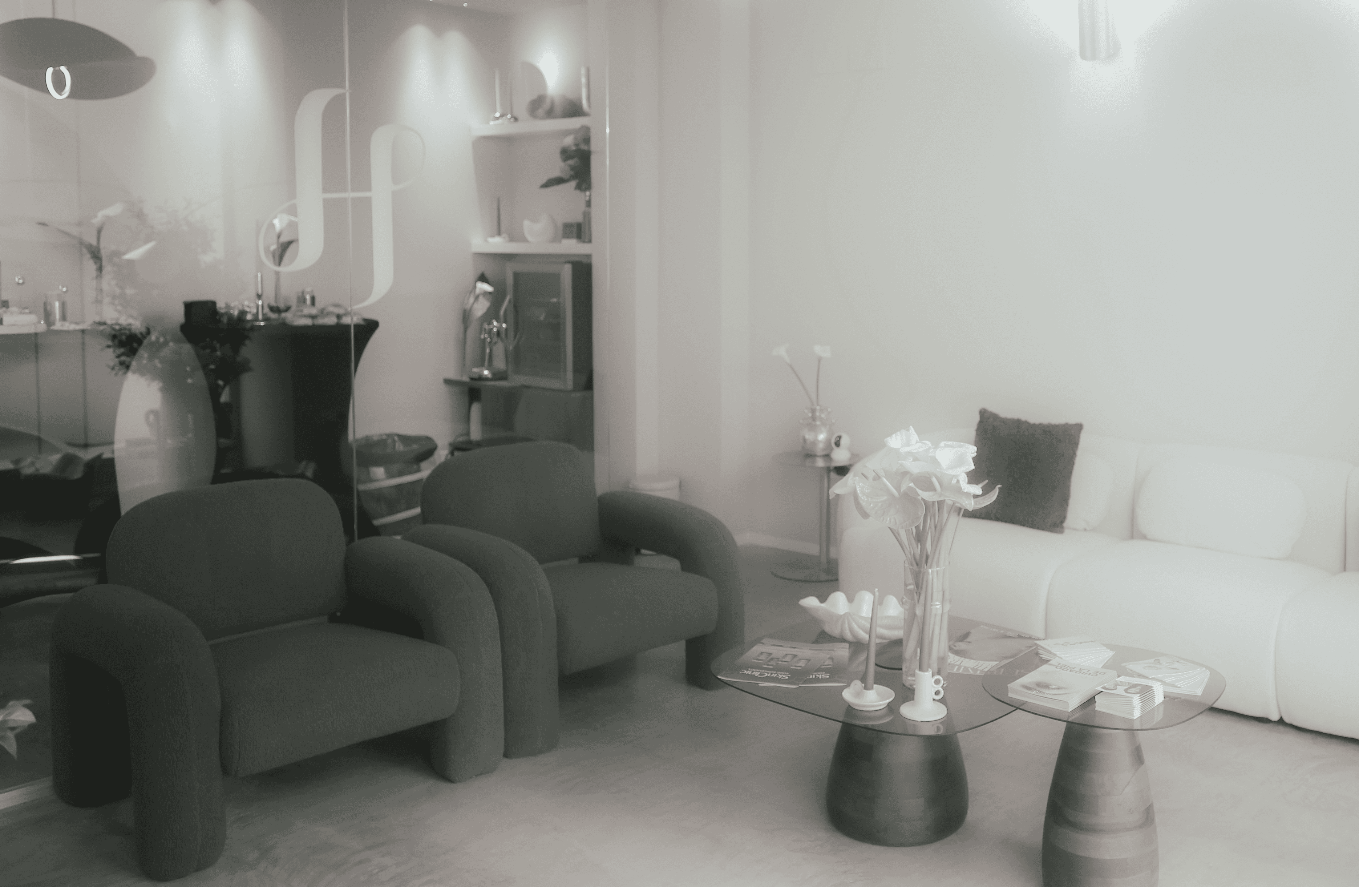 A close-up of a serene face illuminated by soft light, with shadows creating a patterned effect across the skin.