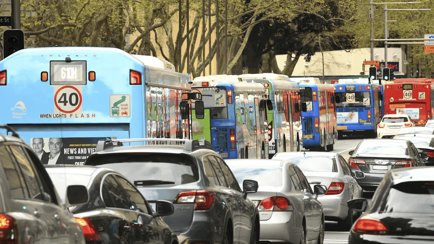 6 buses stuck behind each other in heavy traffic