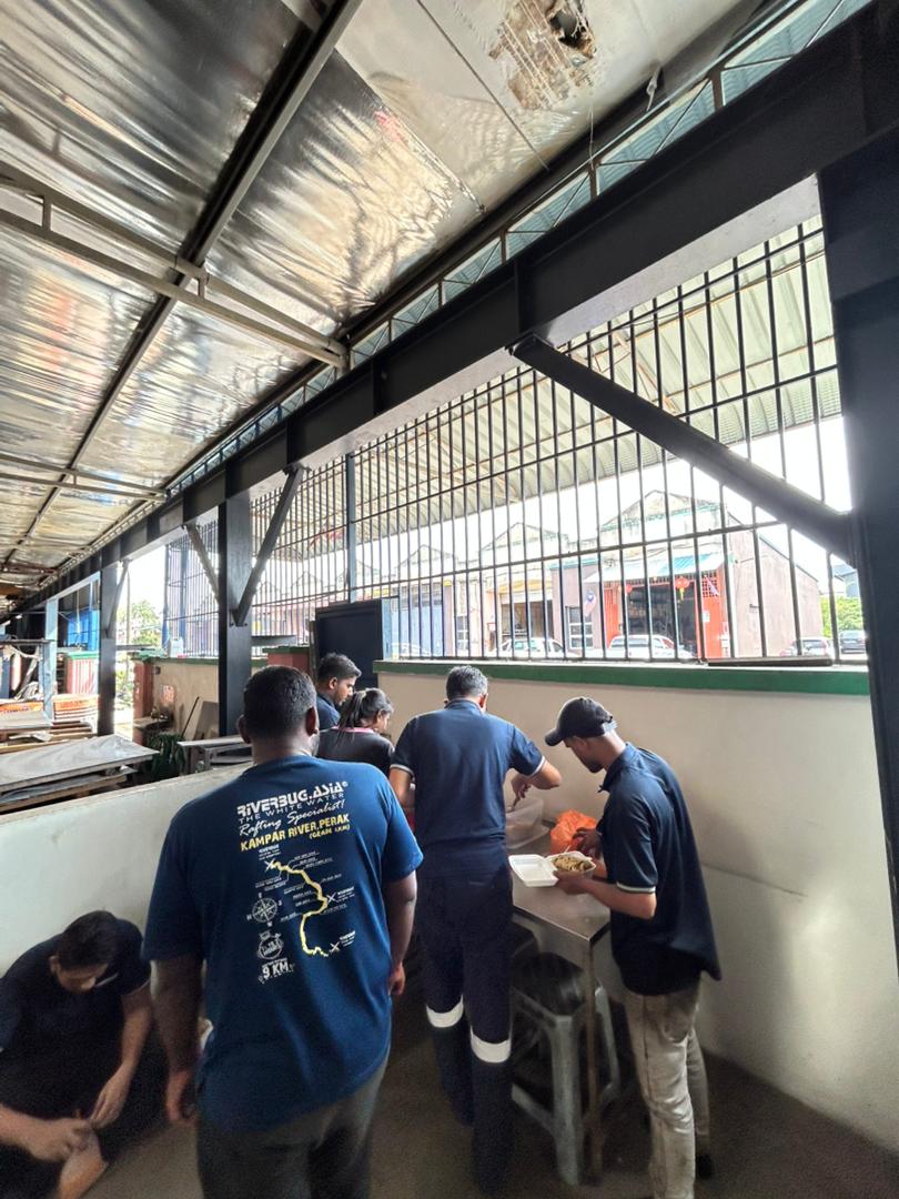 Autofill staff collecting their food during the Deepavali tea break event.