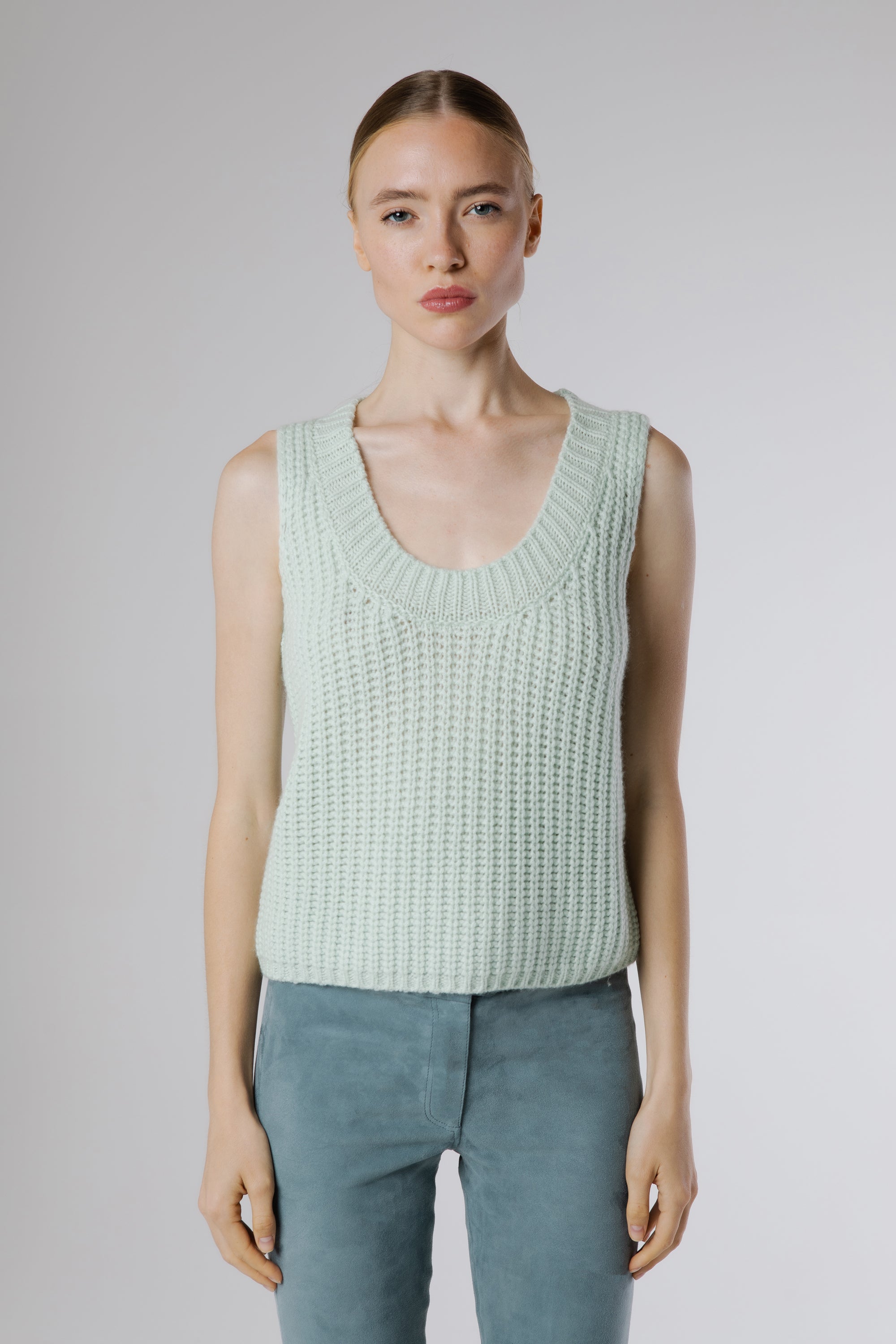 Front view of the Boheme Cashmere Top Salvia in soft sage green highlighting the textured knit, sleeveless silhouette, and elegant scoop neckline.