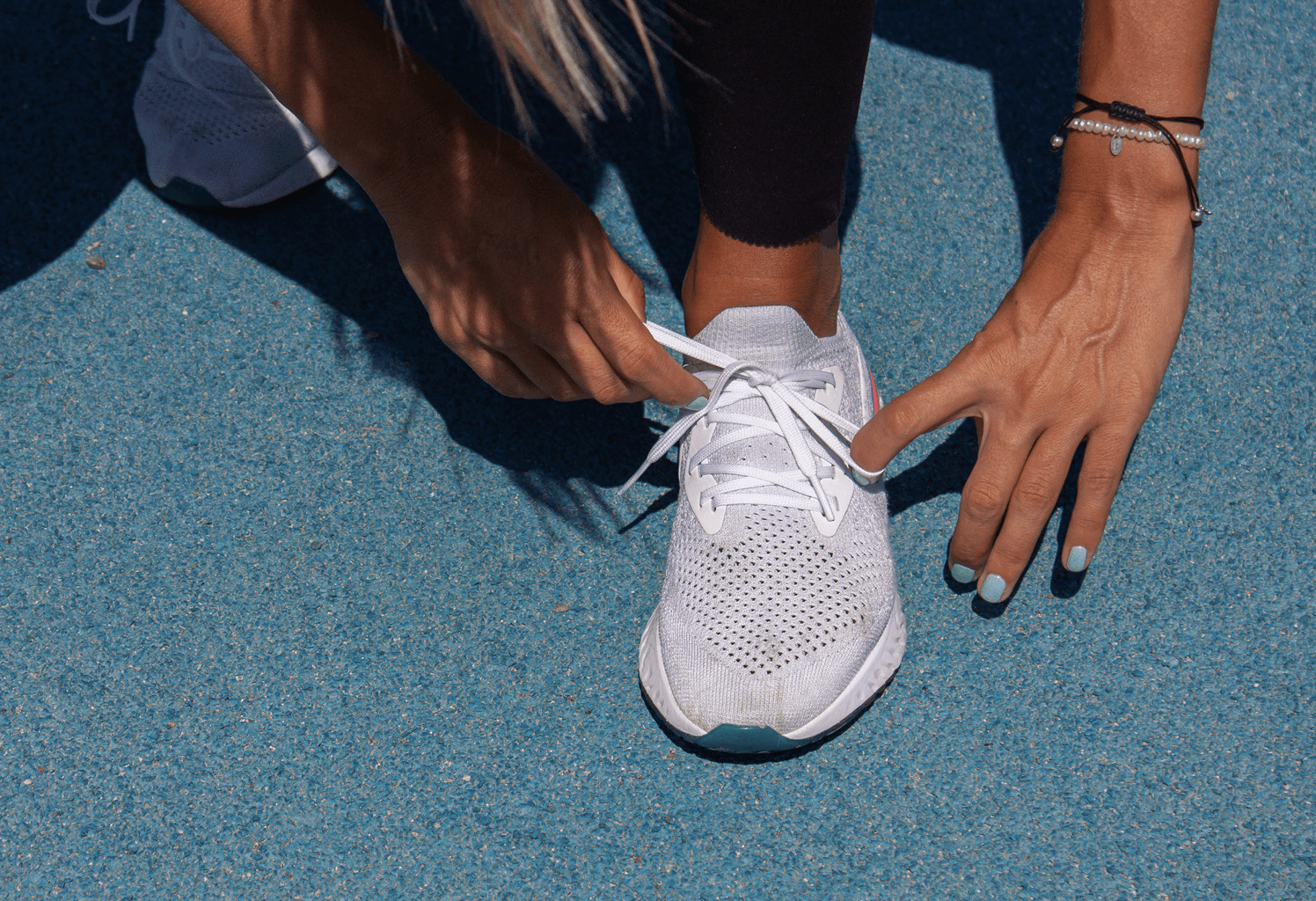athelete tying shoes