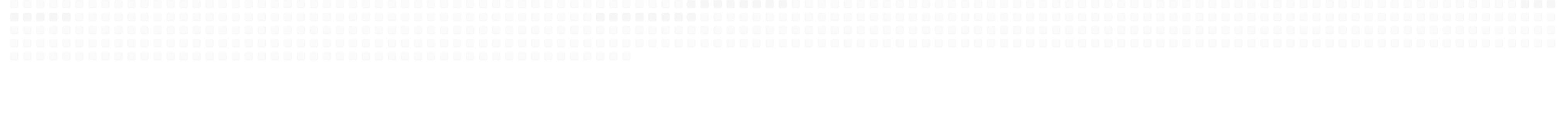 A row of white fence posts supporting a white fence, creating a clean and uniform appearance.