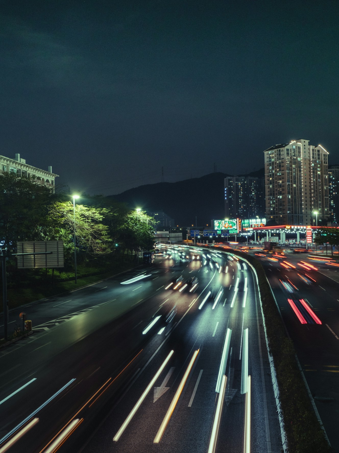 timelapse photography of vehicles and buildings