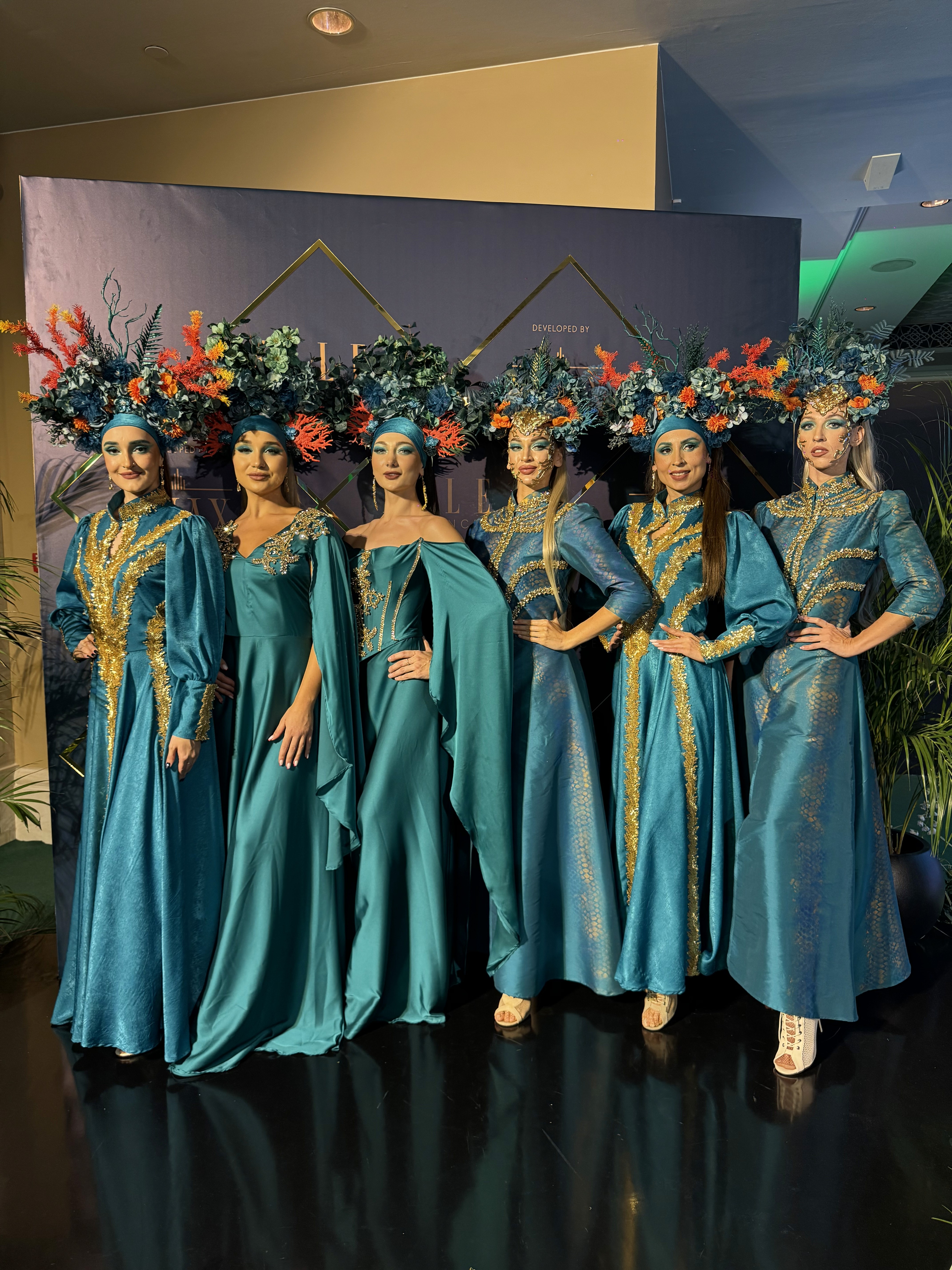 Real estate launch entertainment in Dubai with live performers, screen visuals, branded stage, and corporate event entertainment.