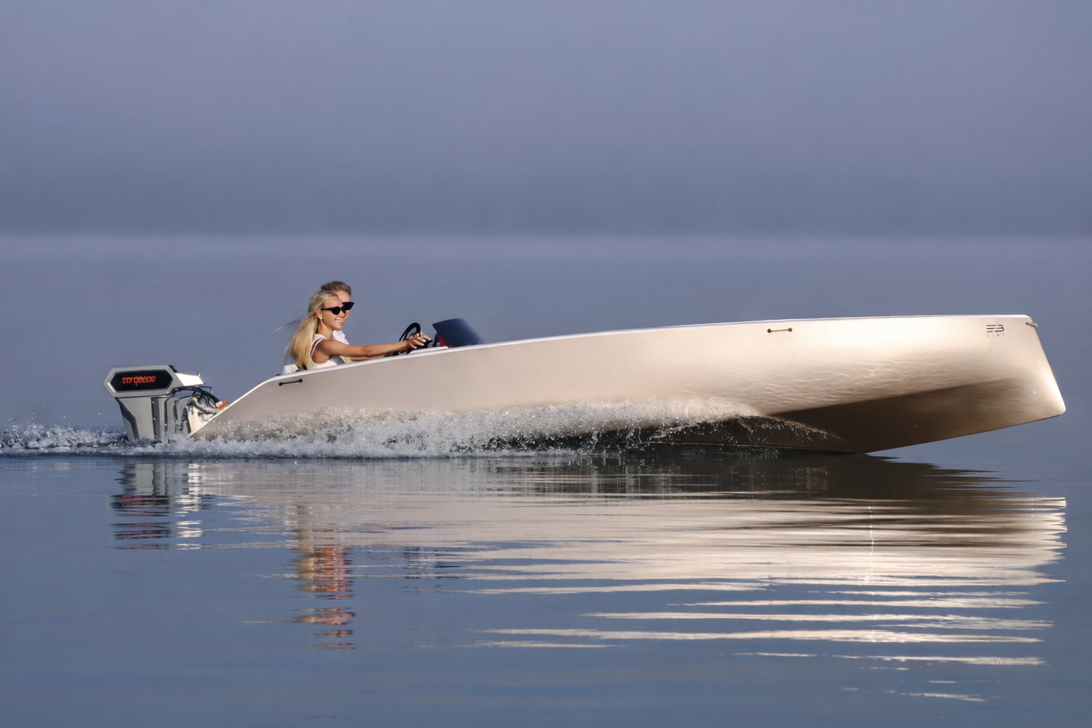 Side view of Kaebon electric boat on calm water with lightweight carbon hull