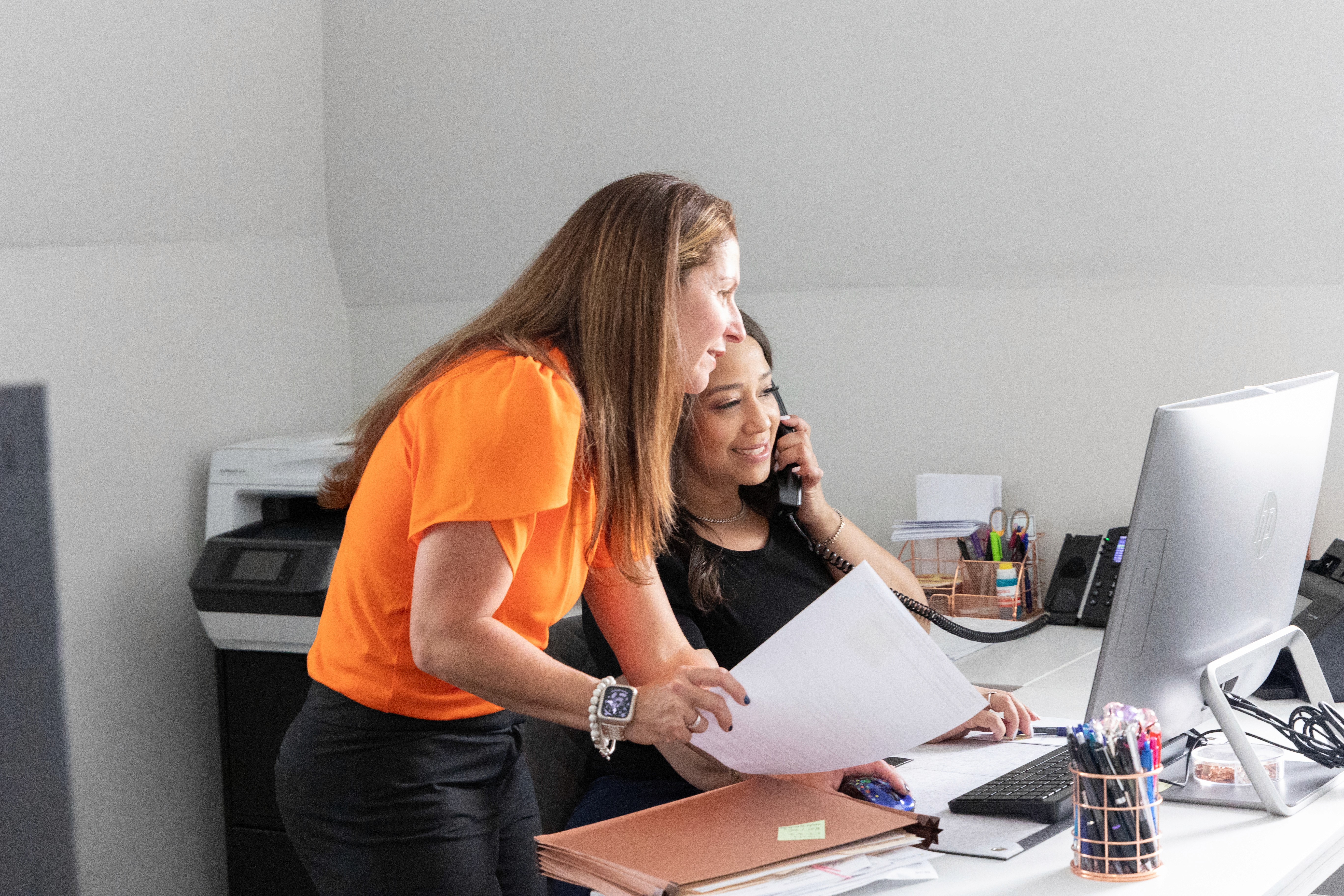 Monique Boucher Lamb, Founding Attorney at Lamb & Lamb, P.C., reviewing legal documents with a client at her Salem, MA law office