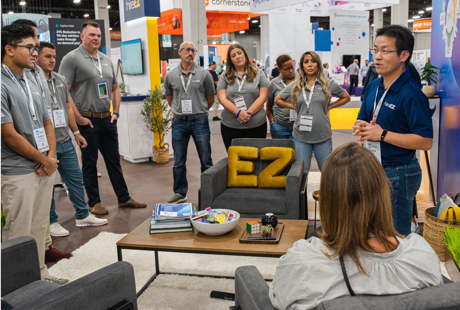 HireEZ both in HR Technology Confrences venue where the CEO is speaking to his team on expectations