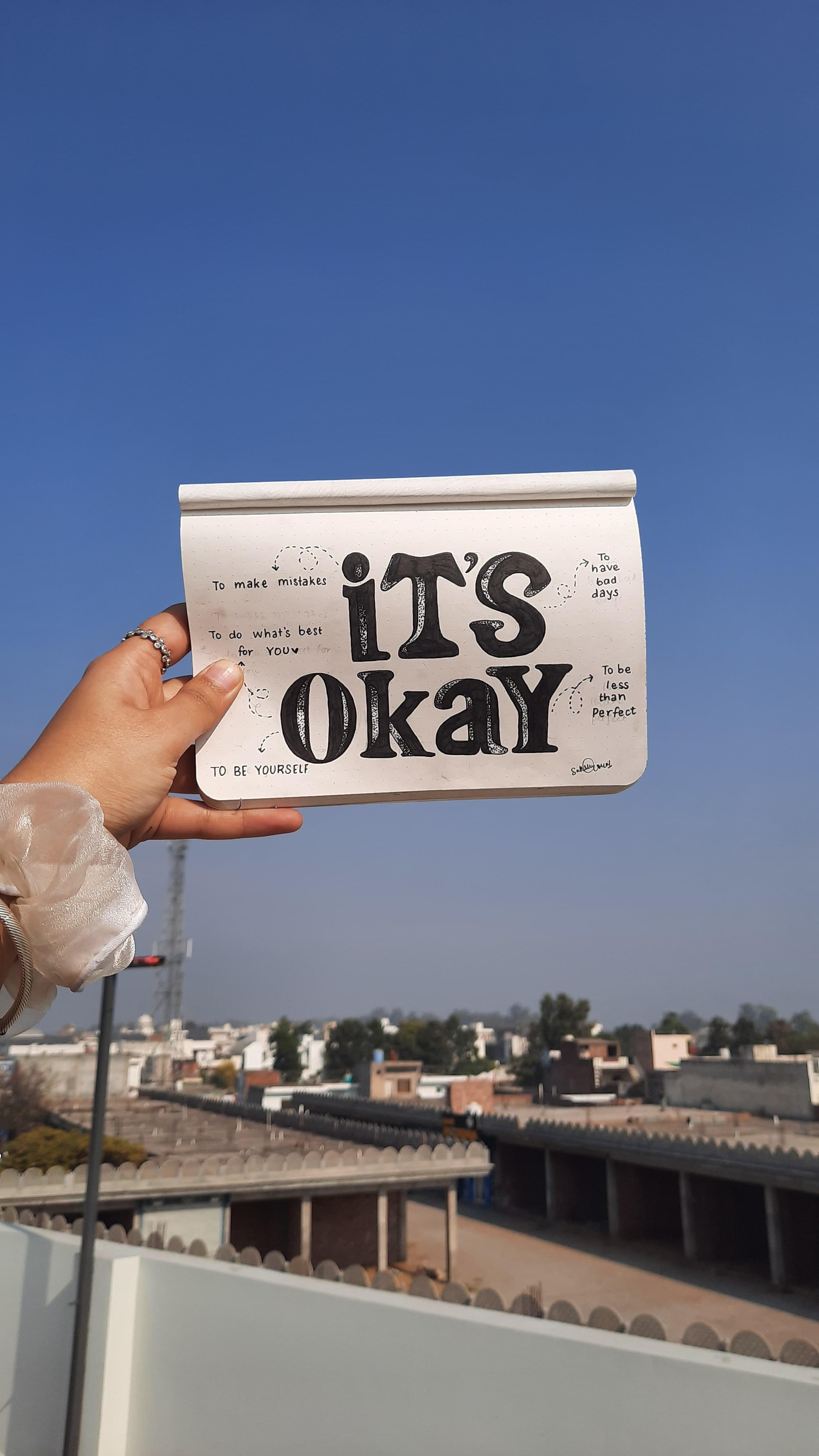 people in a large building with Tate Modern in the background