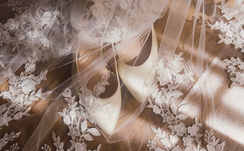 A woman sitting in a chair, working on a laptop