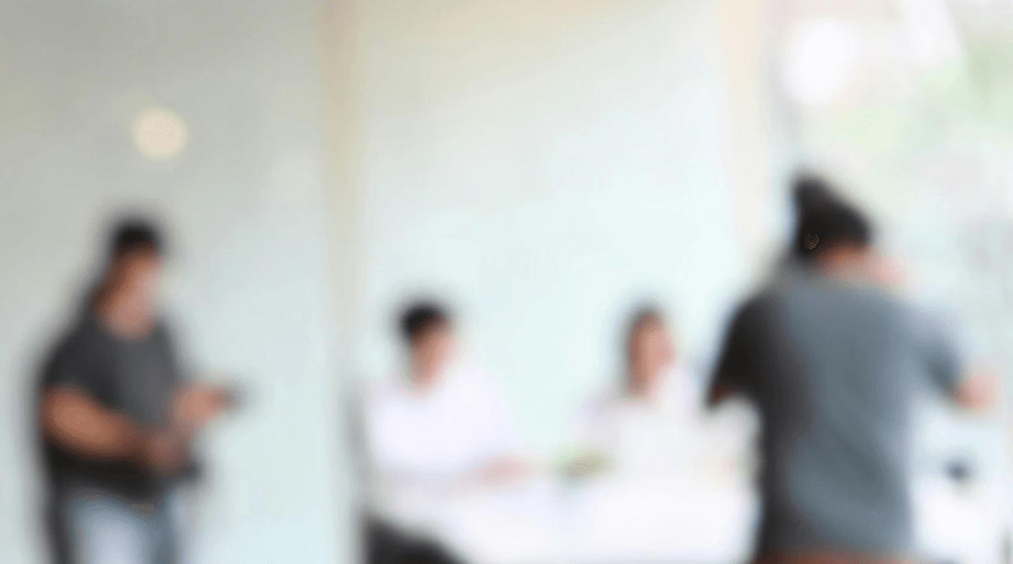 Motion-blurred workshop setting, conveying speed and decision-making.