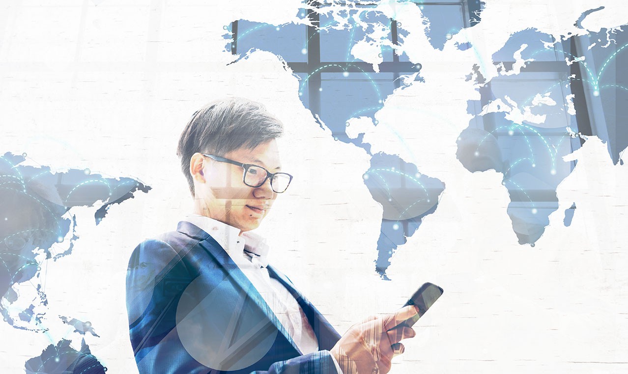 Small and Medium Sized Businesses go Global - Man in front of world map holding phone