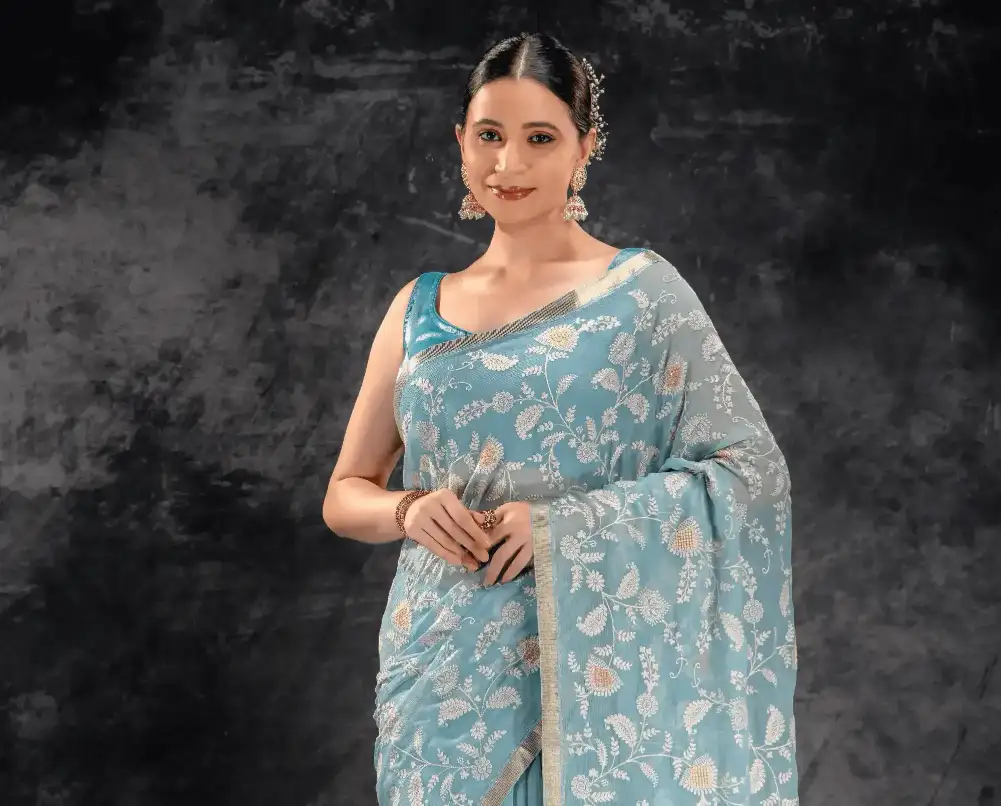 A woman wearing Dusty Aqua Embroidered Chiffon Saree
