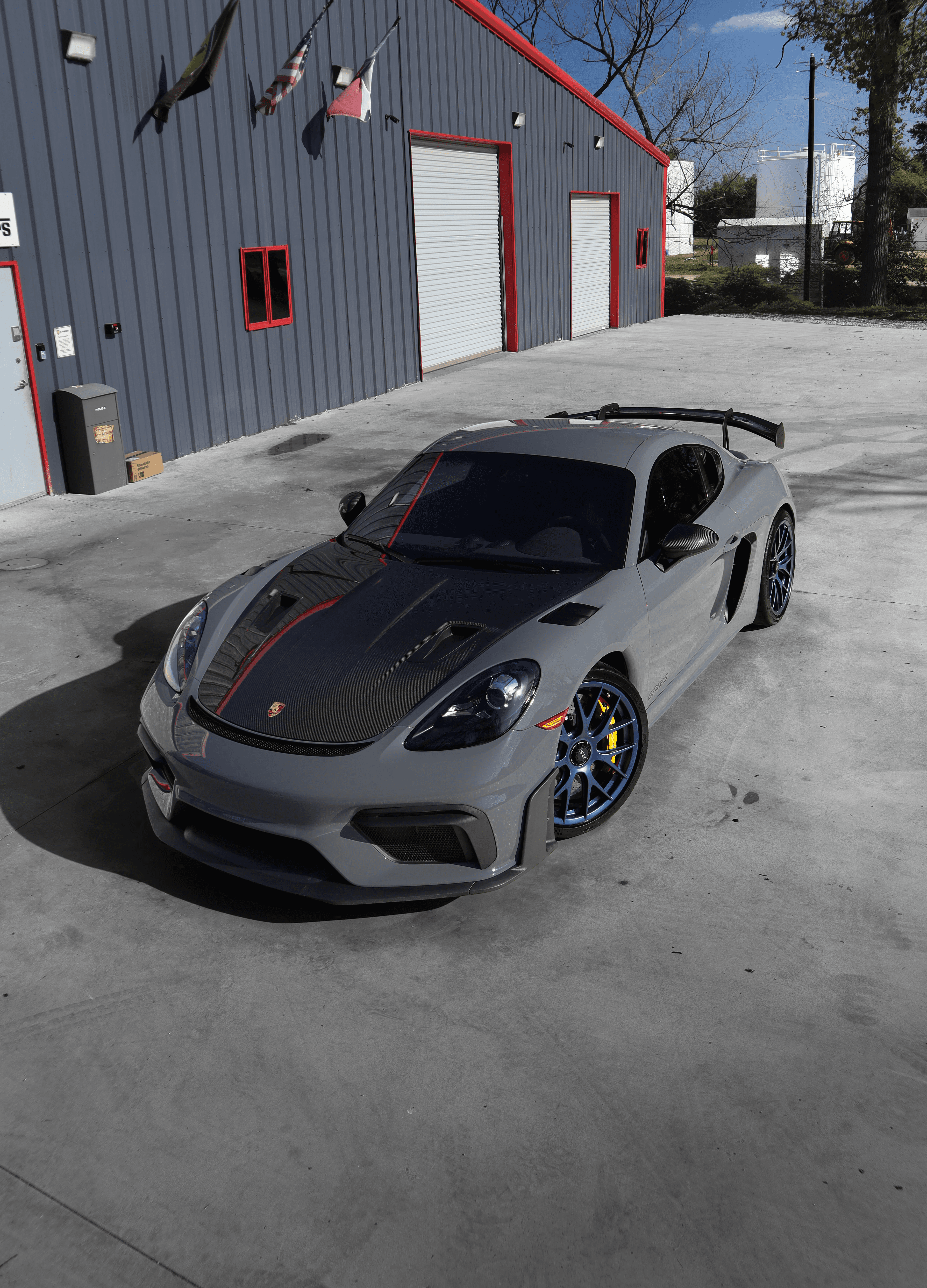 Creative workspace with large windows and a wall full of inspiration boards.