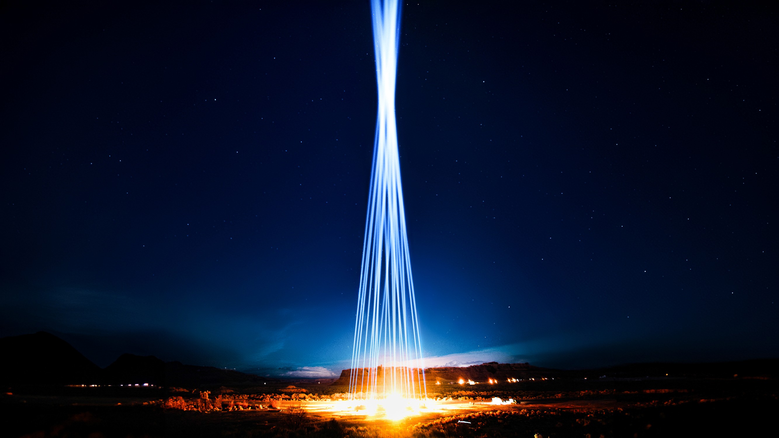 Beams of light shooting into the sky in the Arizona desert for Owen Brown’s ARIZONA music video