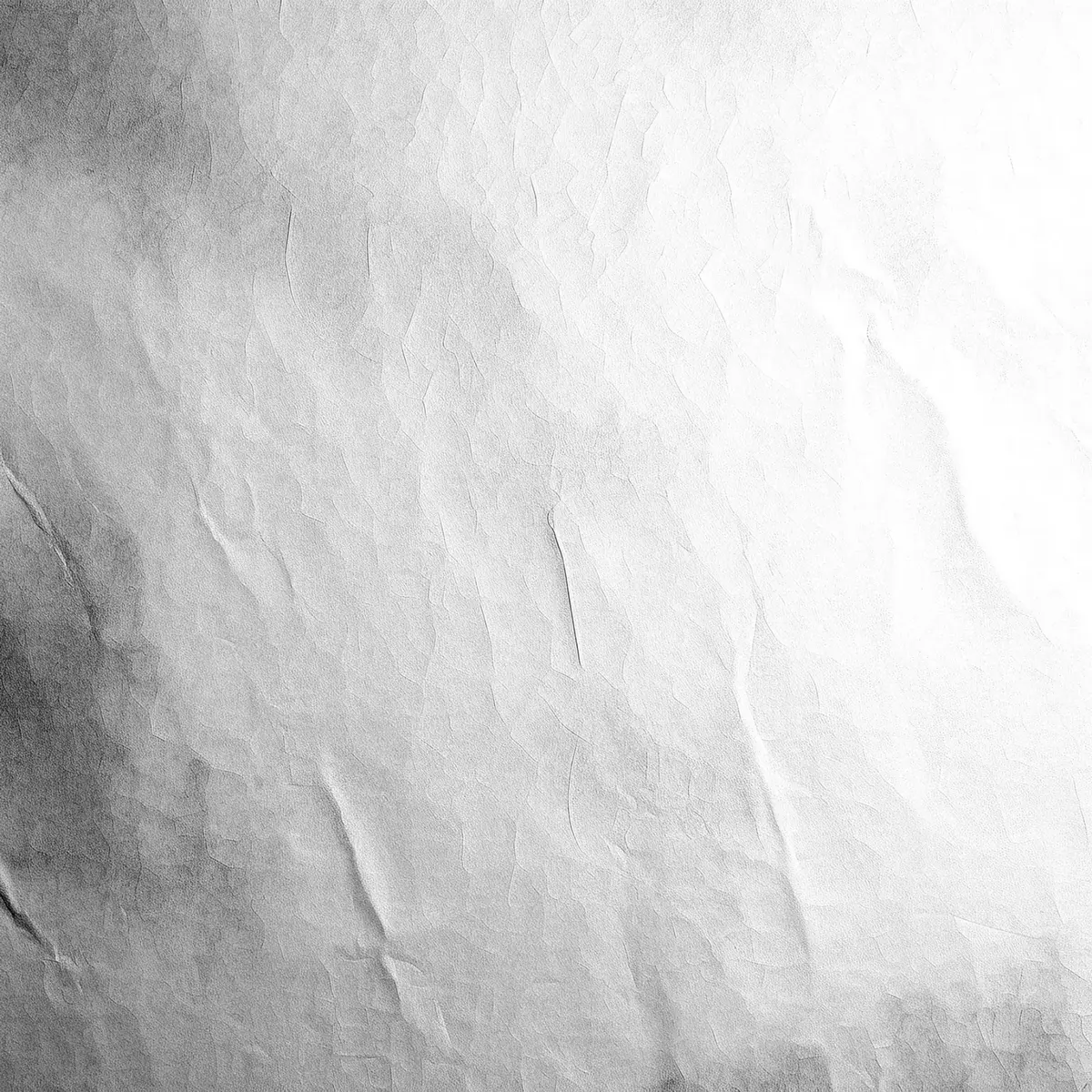 white textile on brown wooden table