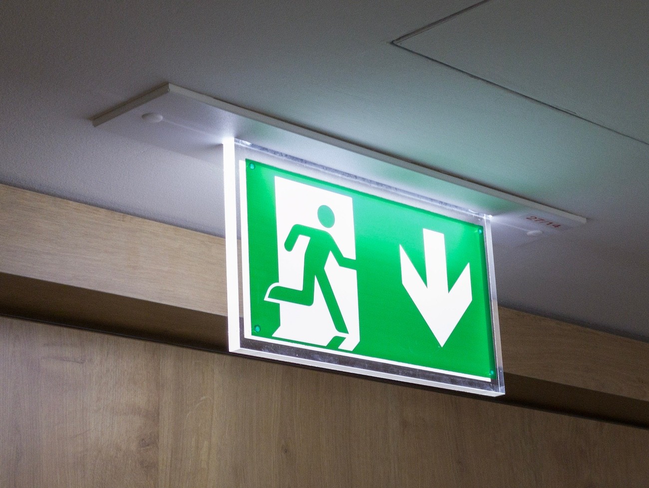 fire exit sign for fire risk assessment on commercial and residential properties
