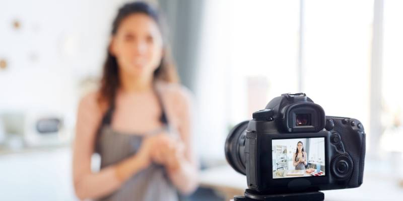 A woman talking in front of a camera