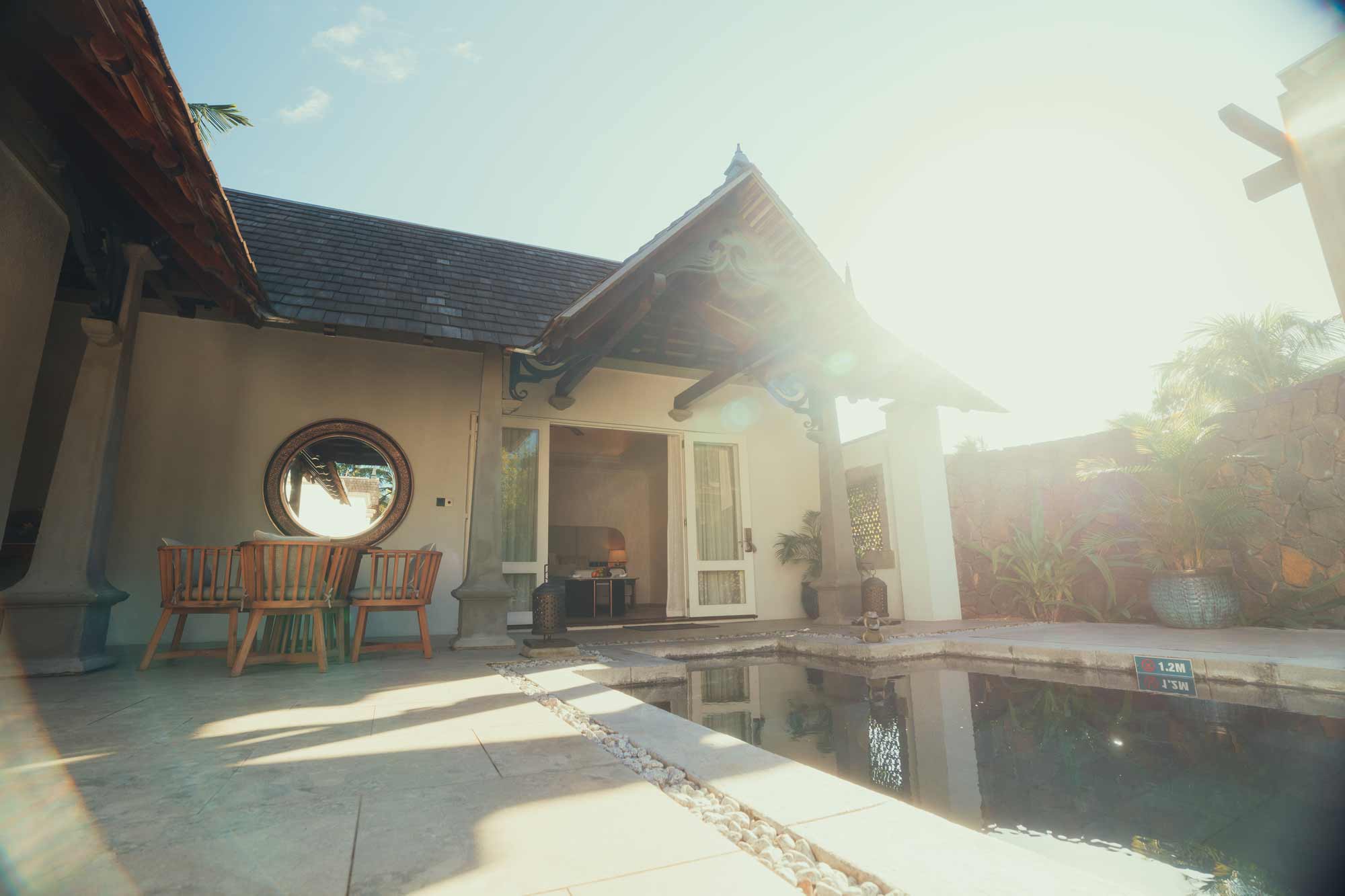 Sunny patio with rustic chairs, filmproduction ad for a hotel in mauritius
