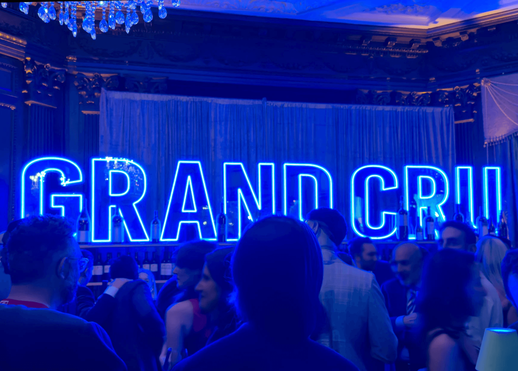 Blue neon letters spelling Grand Cru