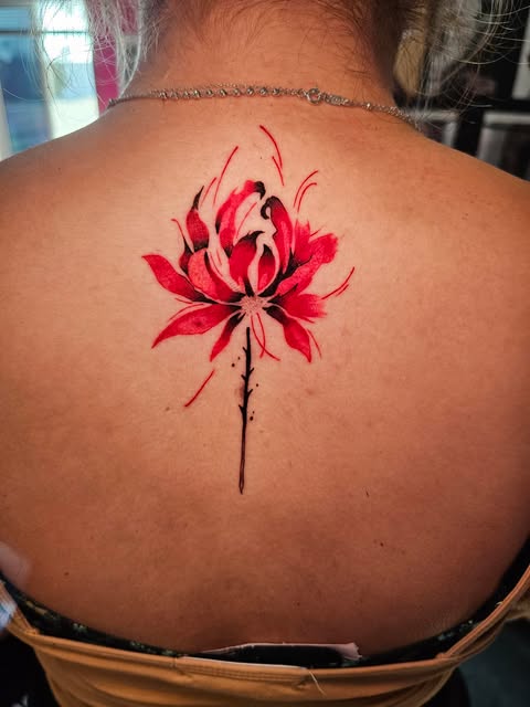 watercolor style red lily tattoo