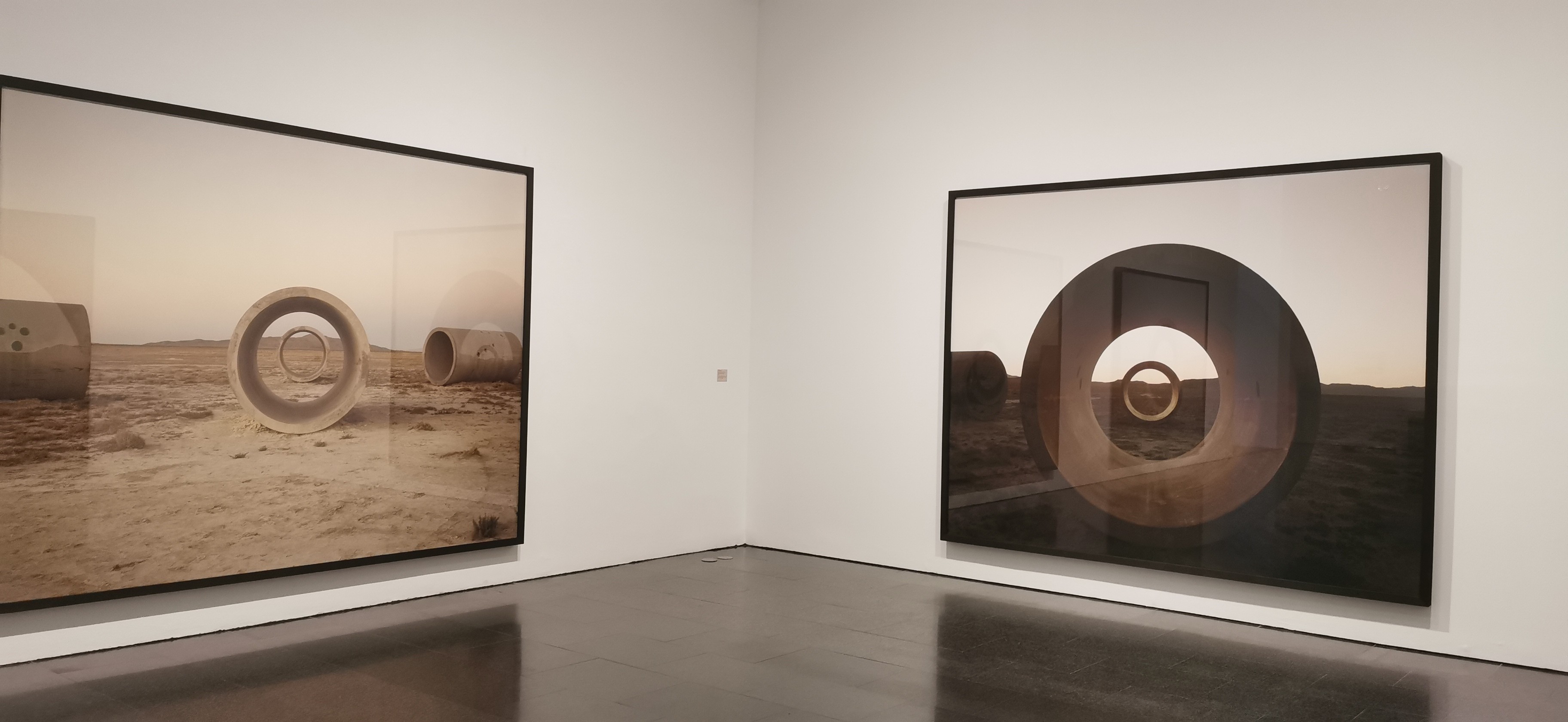 a group of people walking on a sidewalk