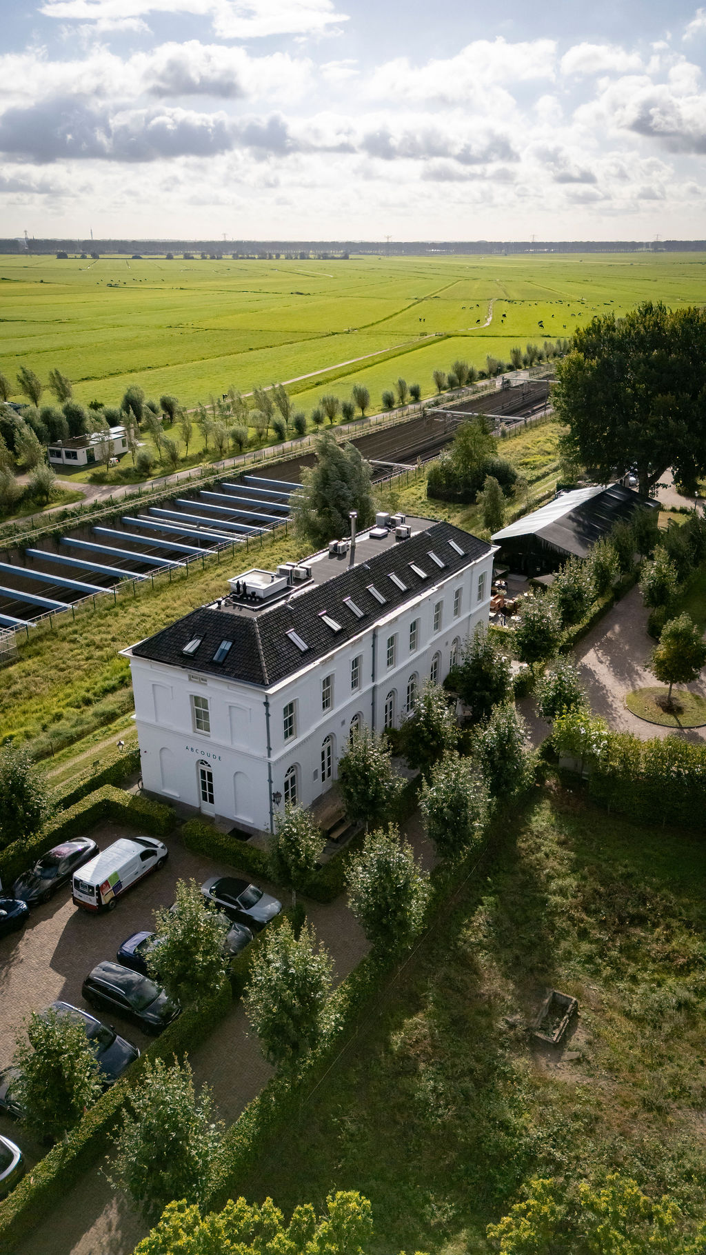 mountain valley with green grass and little village in the middle