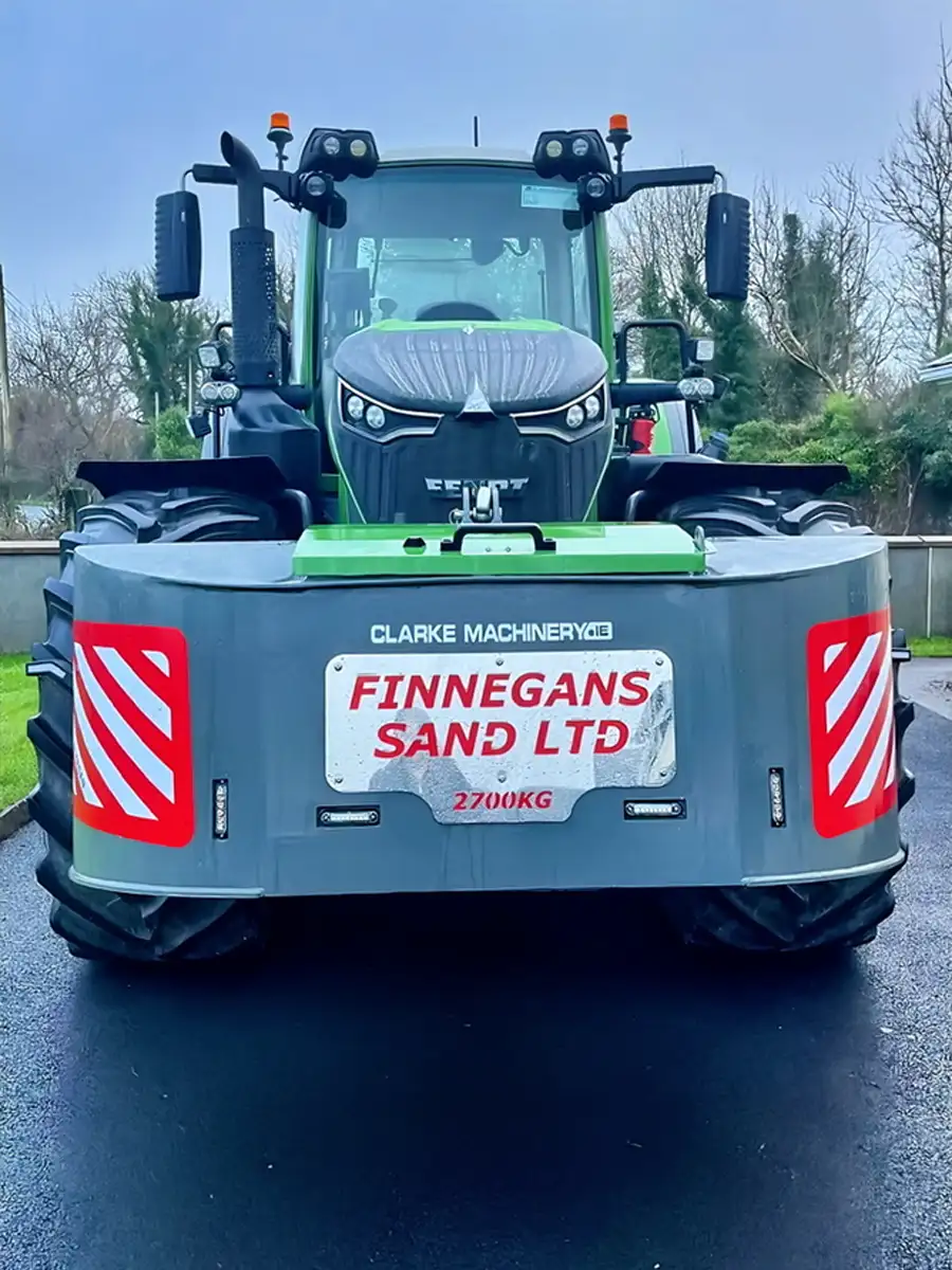 2700 kg grey and red weight block with internal tool box storage and a custom name plate attached to a green Fendt tractor