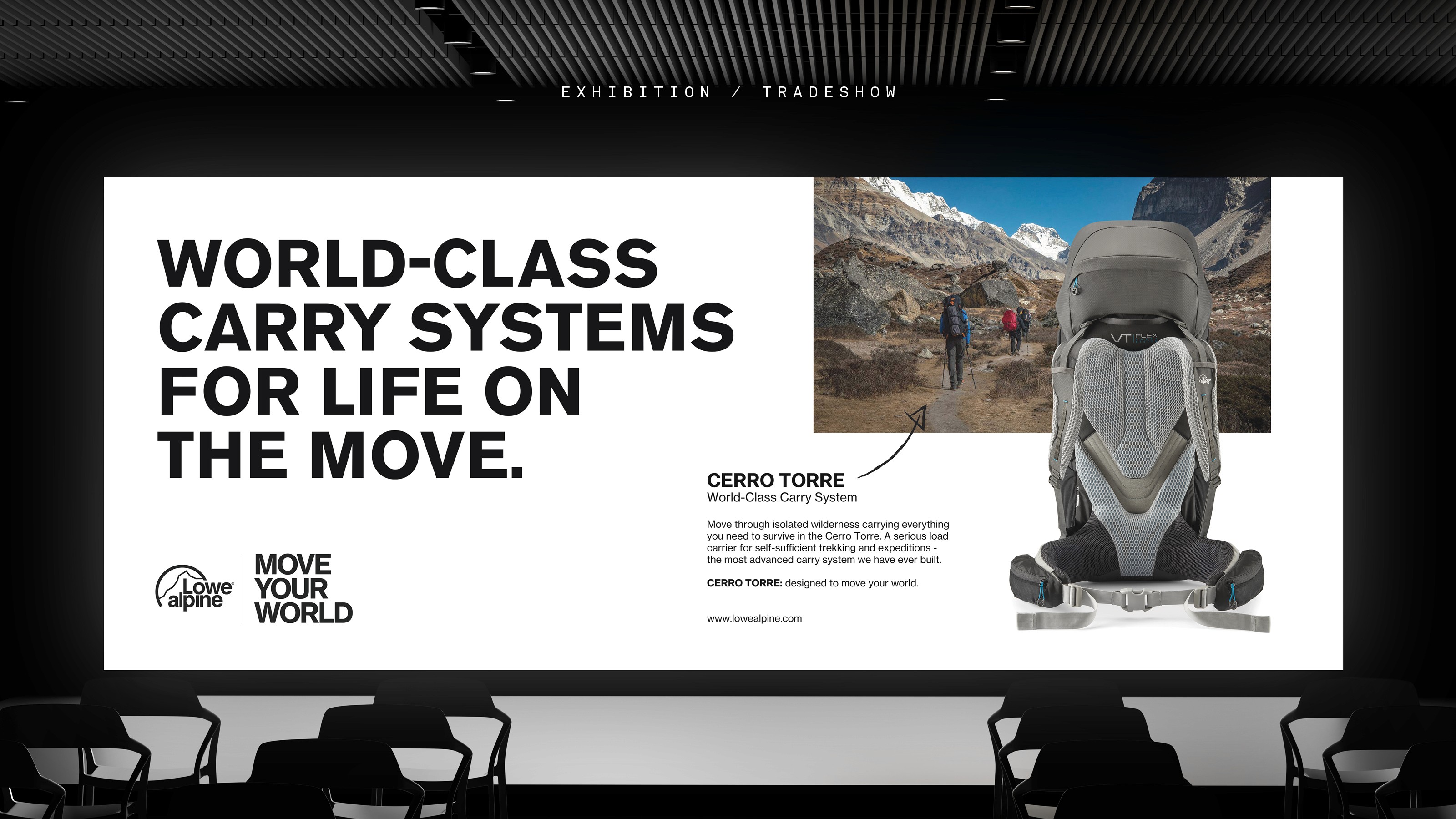 Modern home office setup with a monitor, ergonomic chair, keyboard, and indoor plants near a window with blinds.