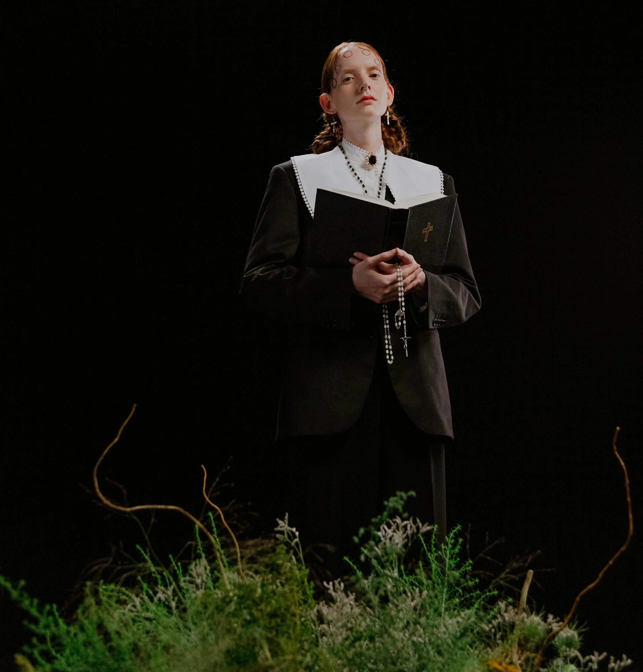 Victoria Hayes with book and grass