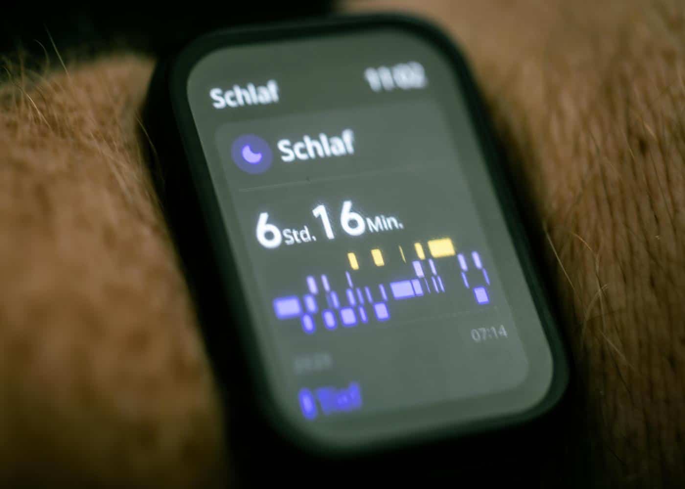 Man checking Apple Watch for Sleep Score to track sleep data on iPhone