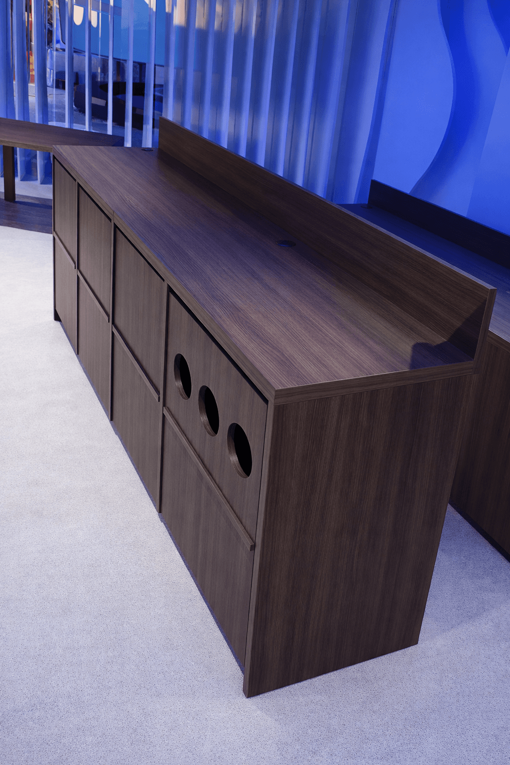 Golden cross atop a domed building with blue sky.