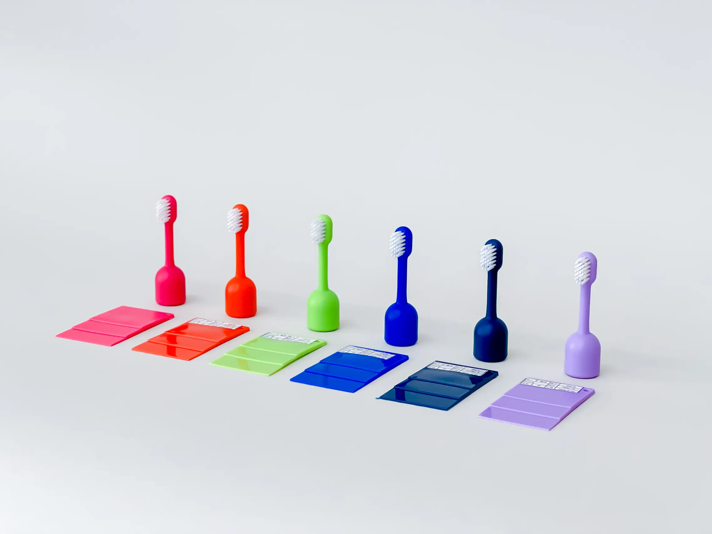BABSY toothbrush components in multiple colors displayed with matching material sample cards