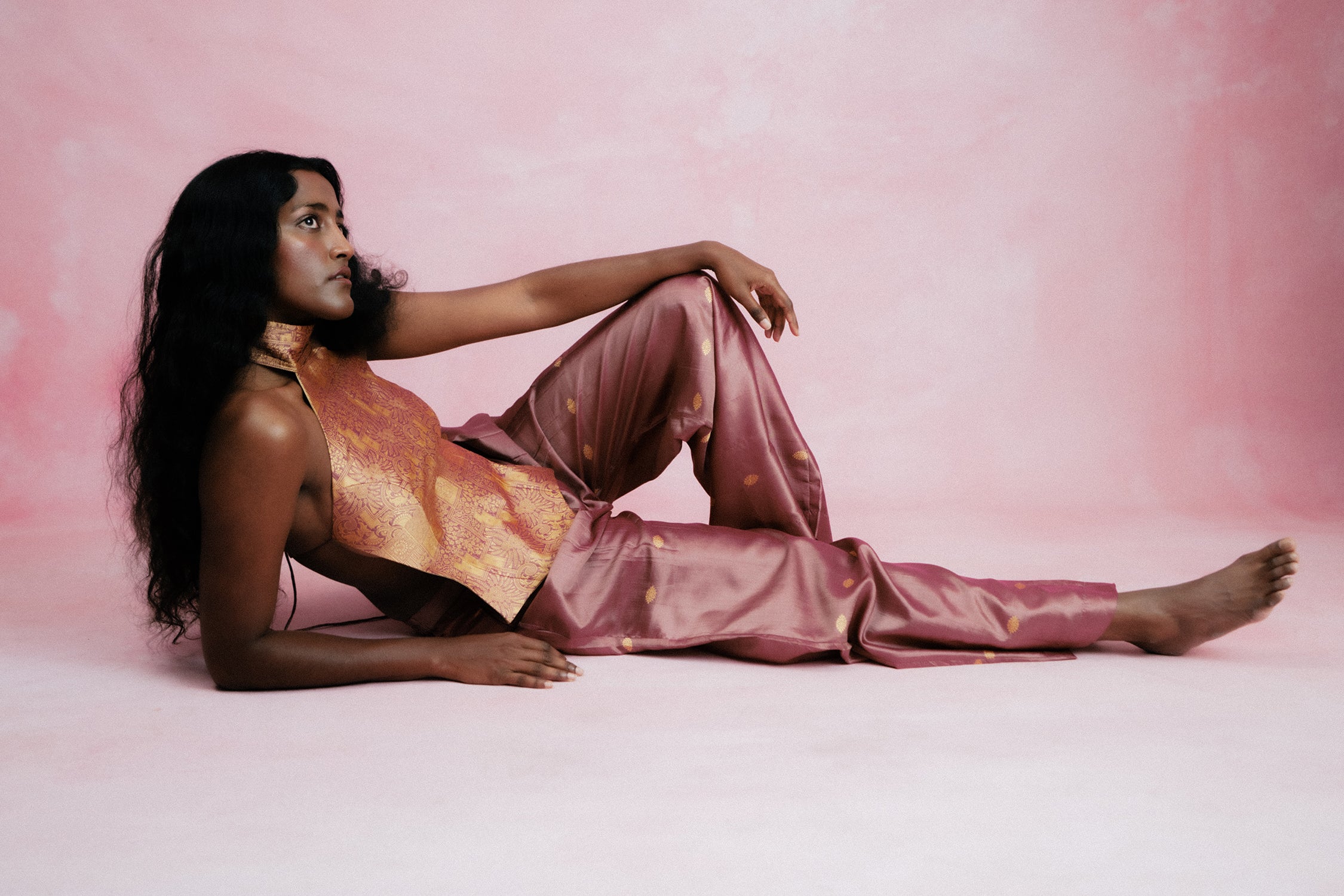 Apsara is our high-neck, backless top crafted from a brocade vintage silk saree, inhouse by skilled artisans. 