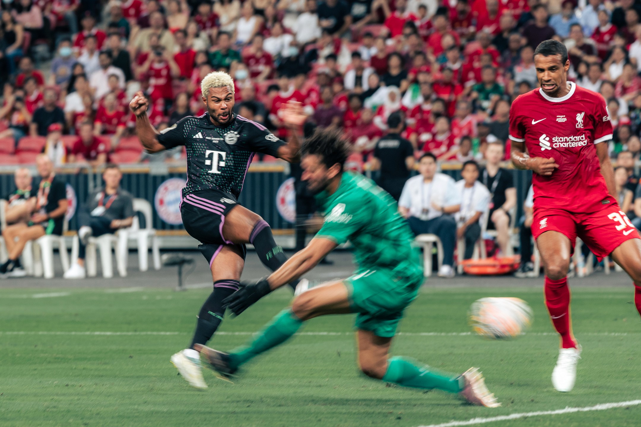 Serge Gnabry of Bayern Munich taking a shot against Liverpool, photographed by Edmund Wong