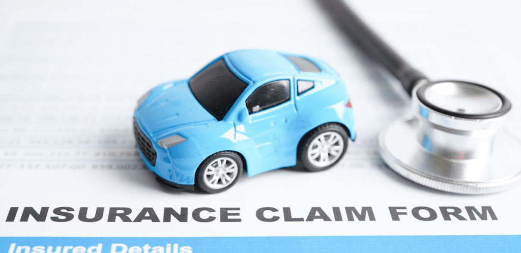 toy car on an insurance document