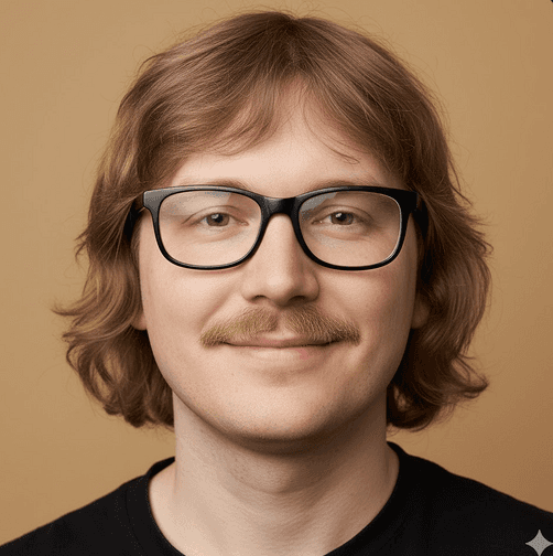 Smiling person with wavy, light brown hair, glasses, and a mustache against a warm beige background, conveying a friendly and approachable vibe.