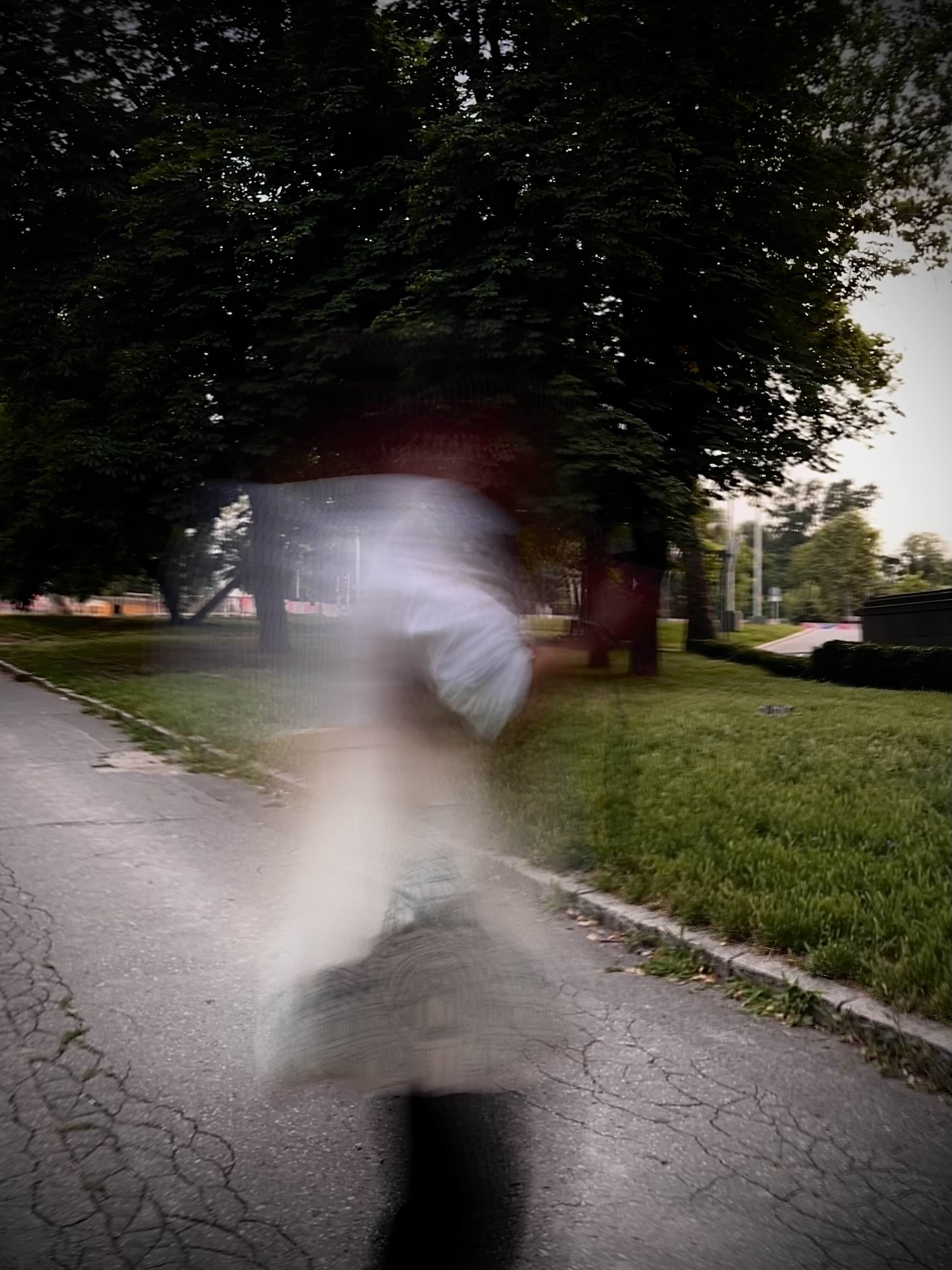 a blurry photo of a person standing in front of a wall