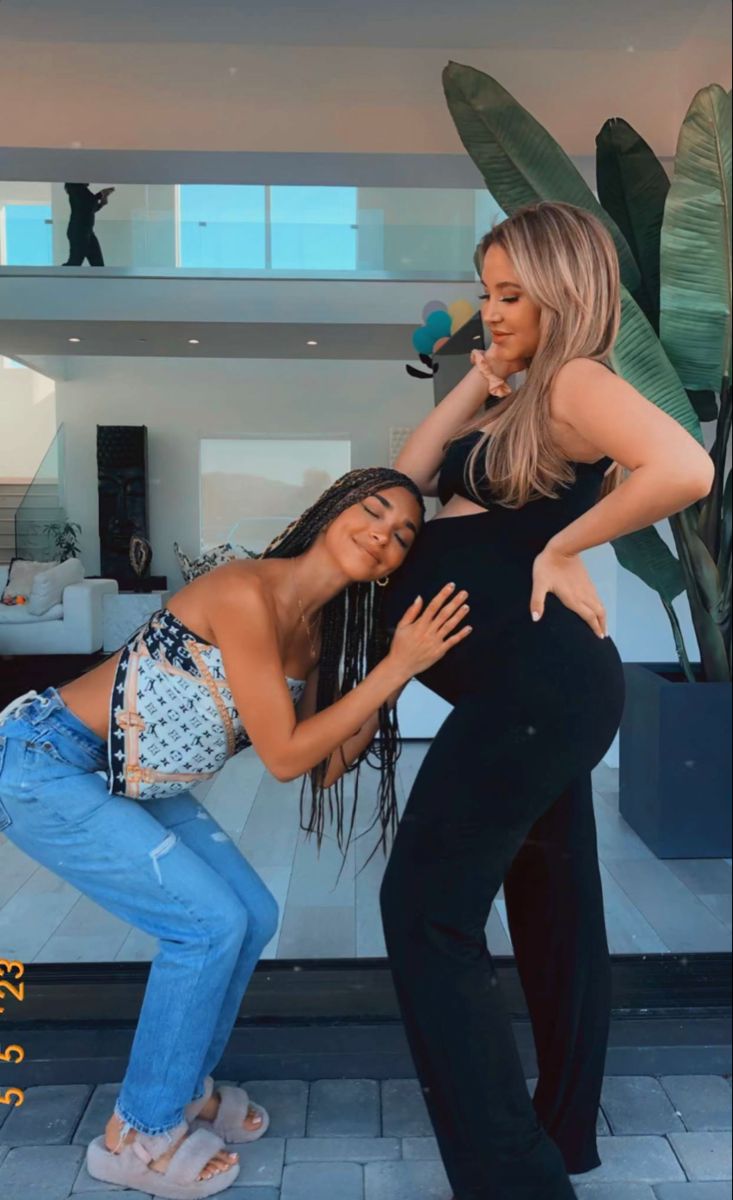 woman in white long sleeve shirt standing on beach during daytime