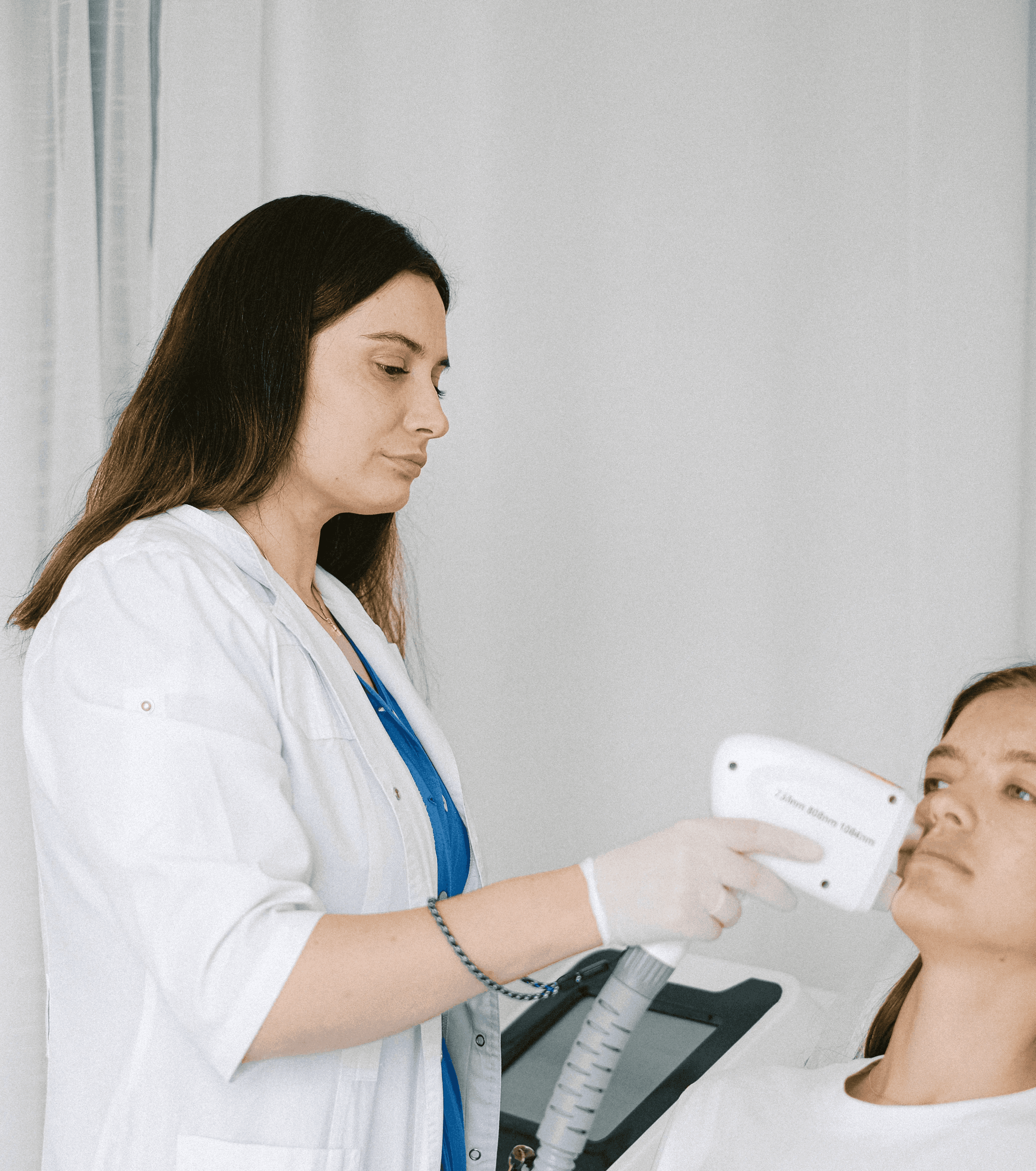 Laser hair removal treatment being performed on a client’s leg for long-term hair reduction and smoother skin.