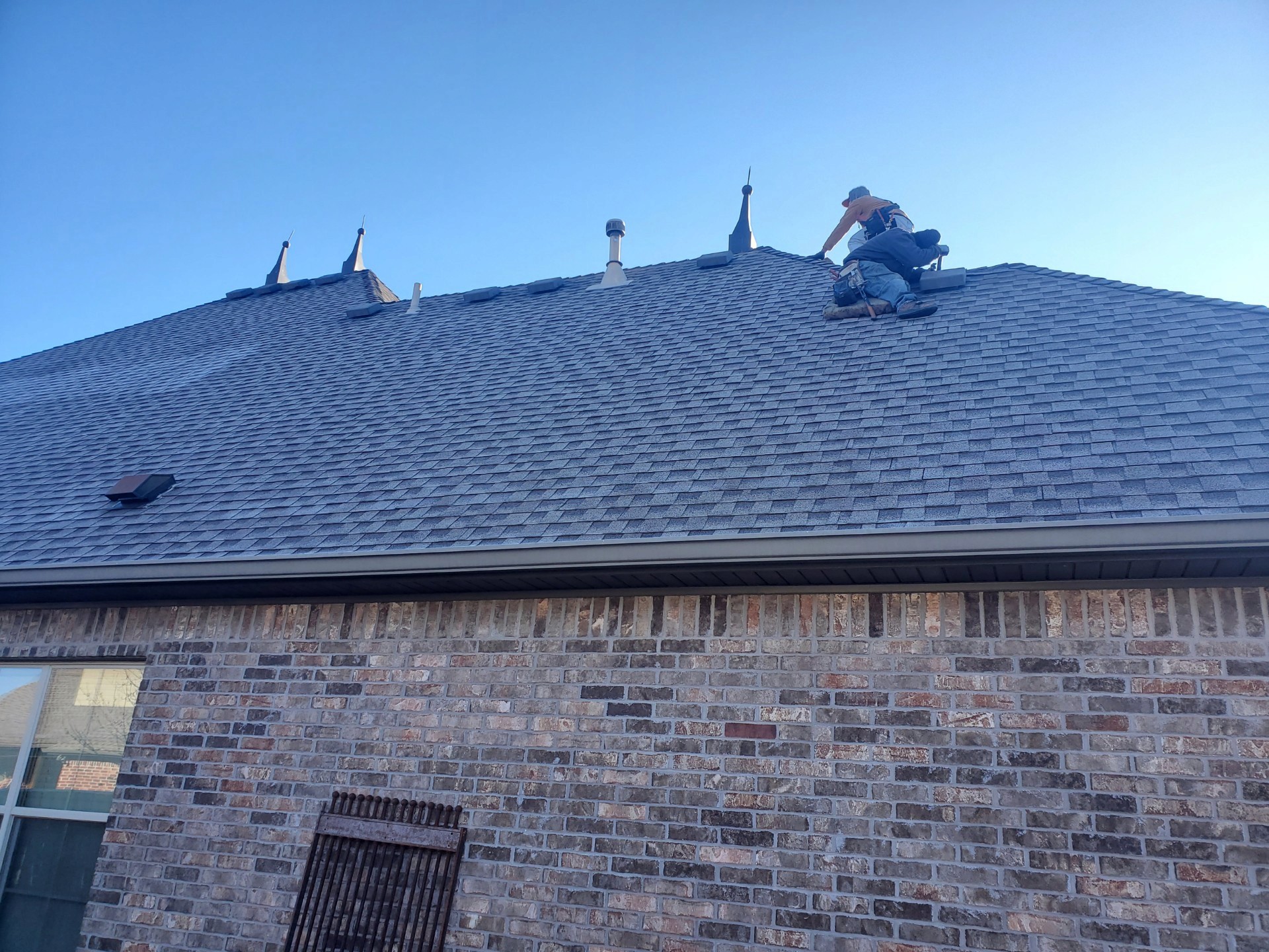 Roofer up on a Roof looking to replace