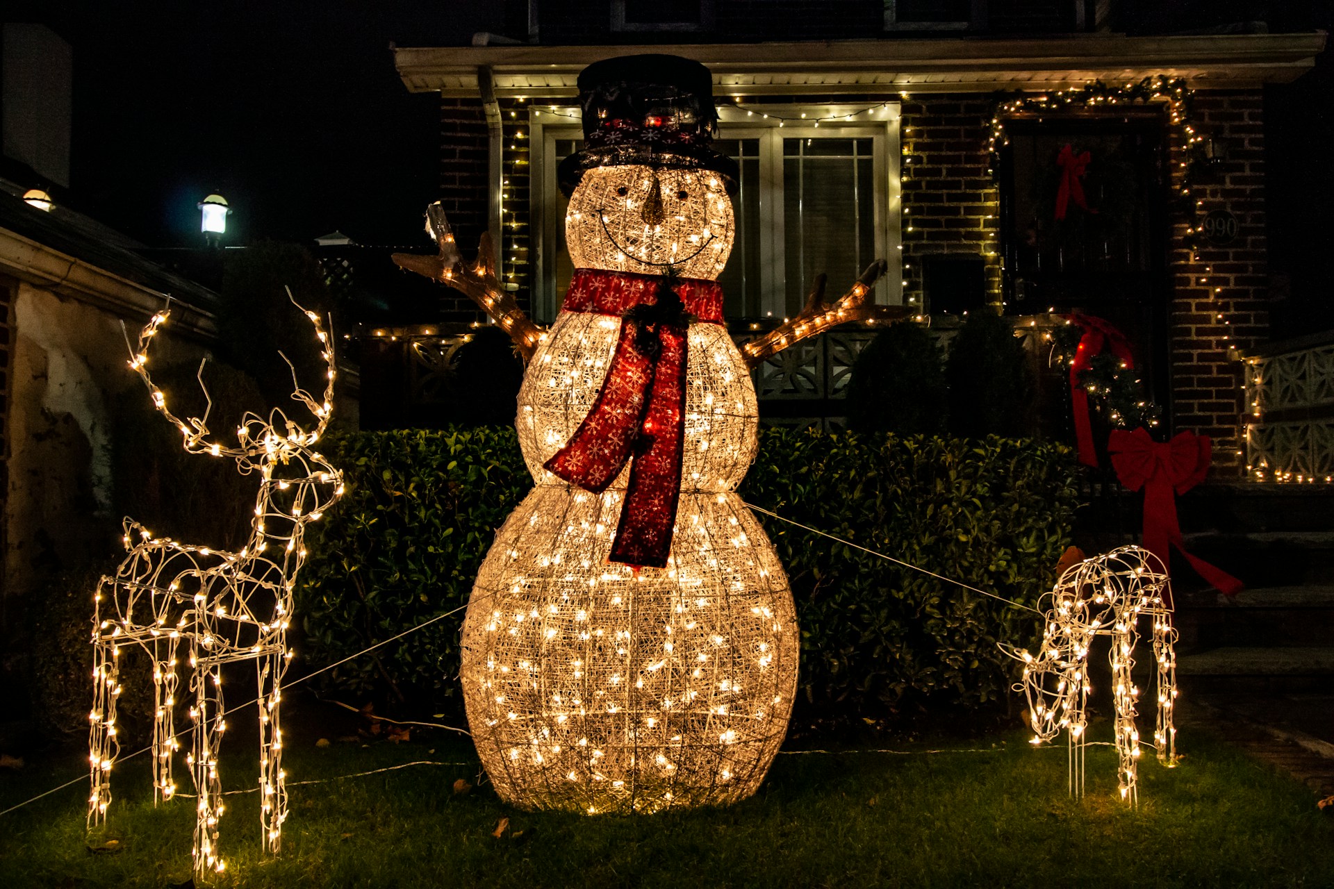 An LED snowman and reindeer illuminated Christmas decoration.