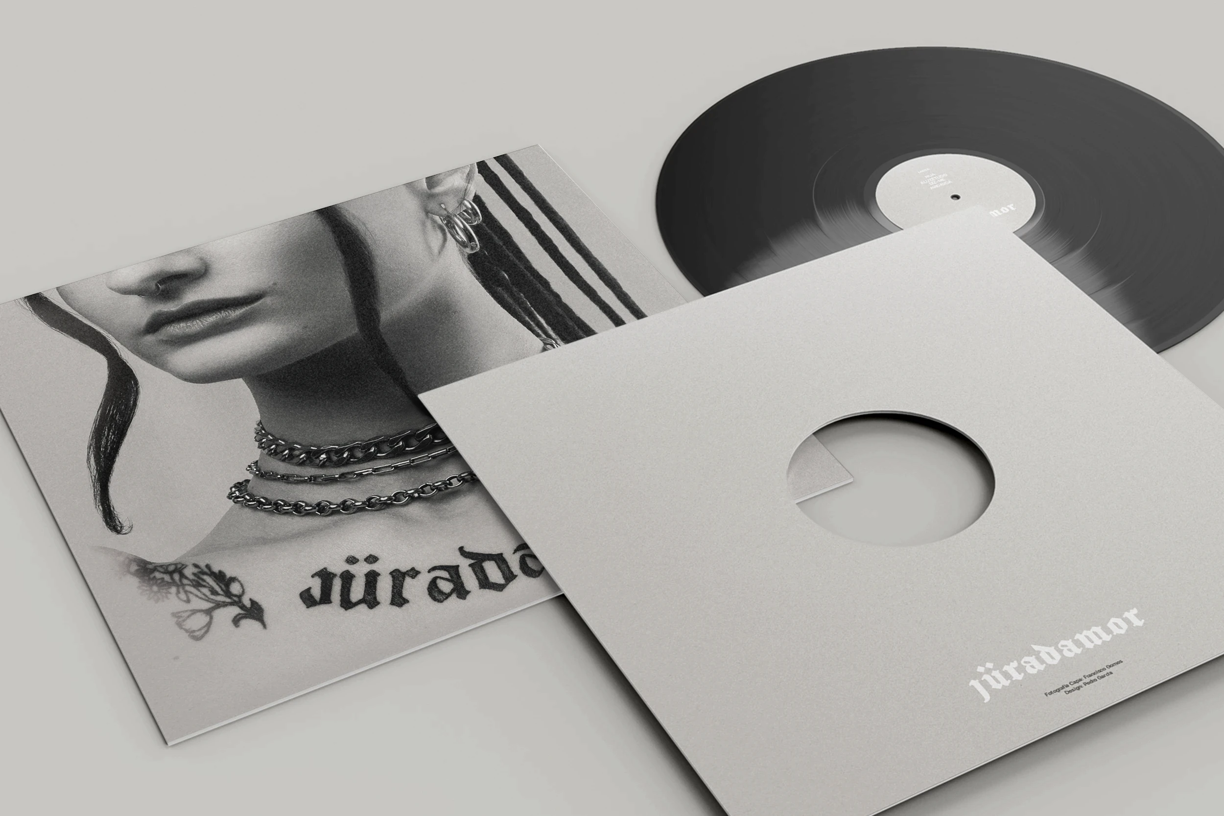 Vinyl record packaging design for Jüradamor featuring minimalist sleeve design and monochrome portrait artwork.