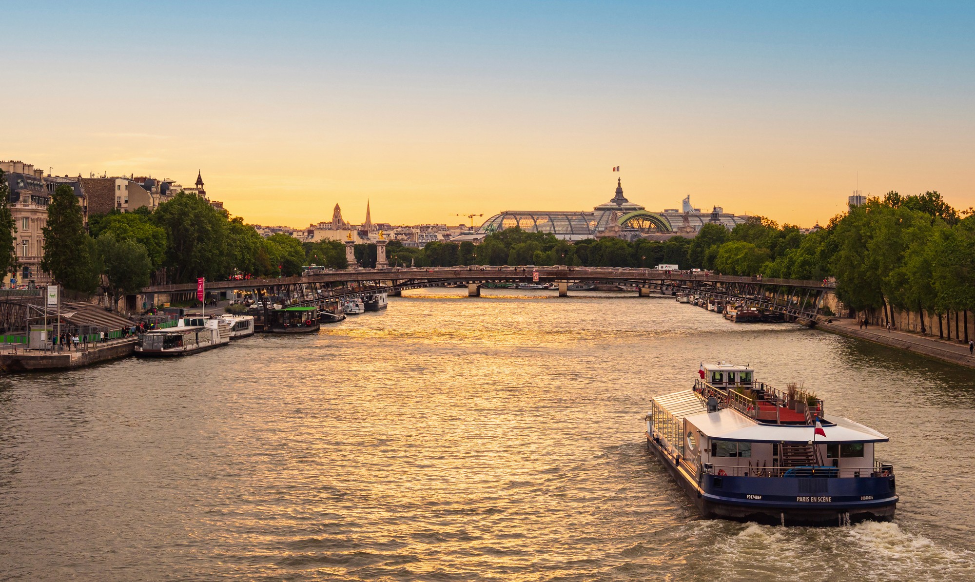A wooden walkway leading to a body of water