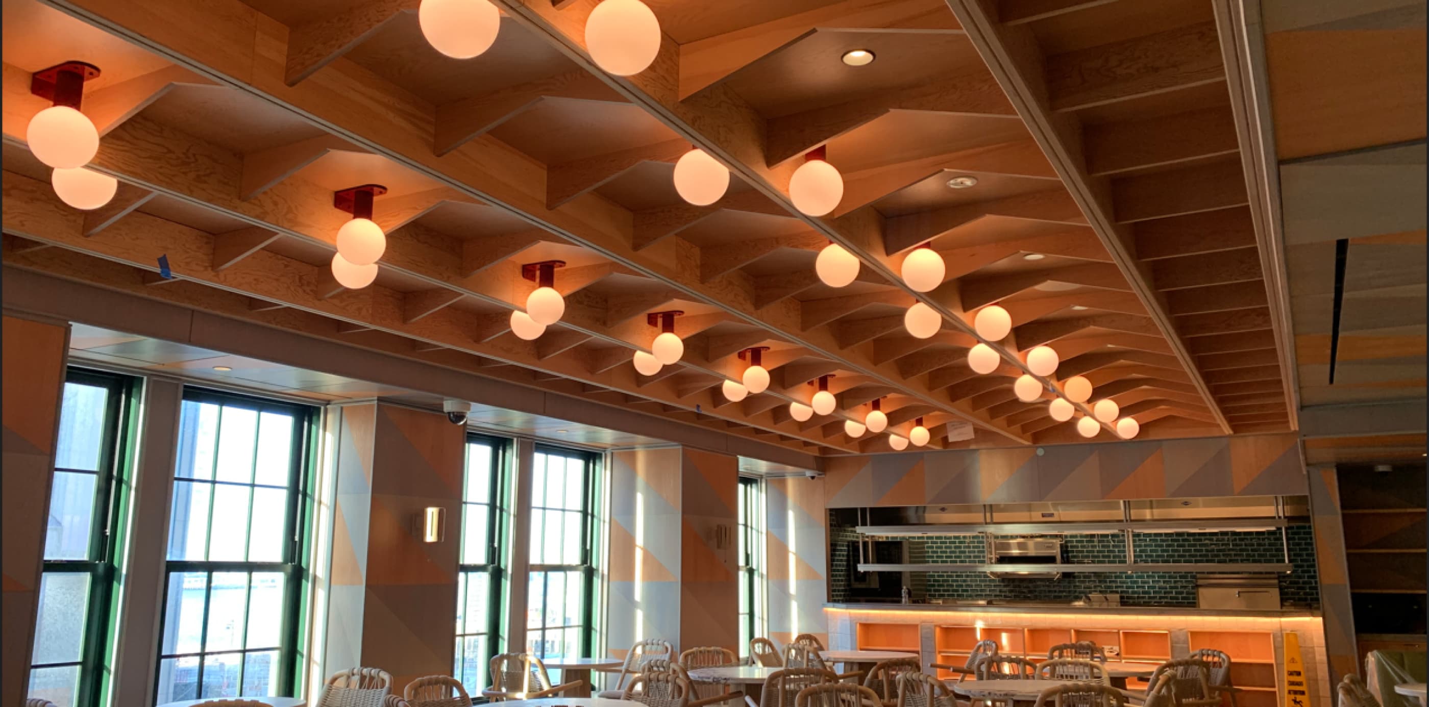 A copper ceiling with small circular lamps