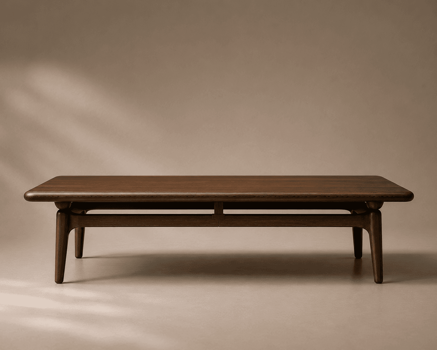 Sthir centre table from the SAMA collection, featuring a restrained wooden structure and balanced geometric proportions.