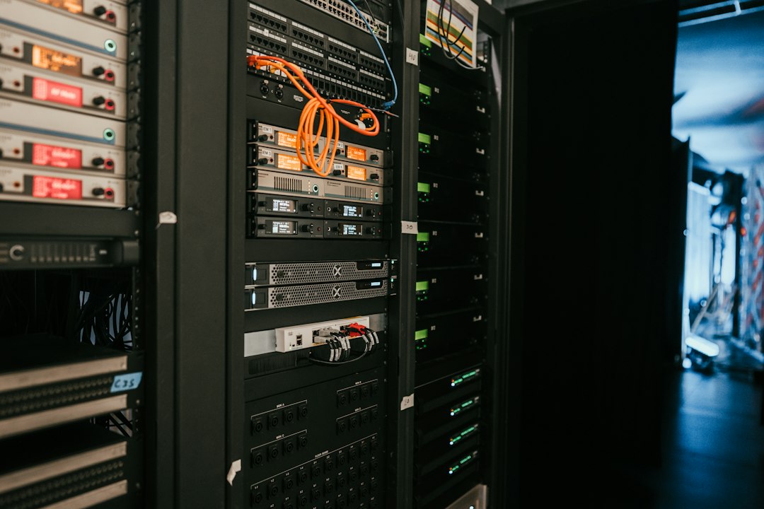 server racks in a secure data center with blue glowing lights, representing cloud-based financial security and data storage