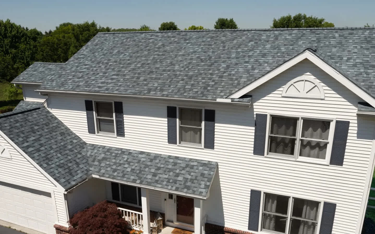 Beauty shot of a beautiful home with Owens Corning TruDefinition Duration shingles in Slatestone Gray color.